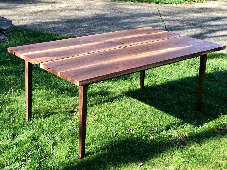 sleek walnut table with cracks and bow ties 