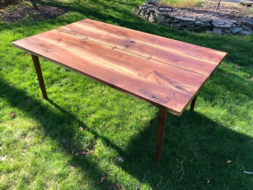 sleek walnut table with cracks and bow ties 