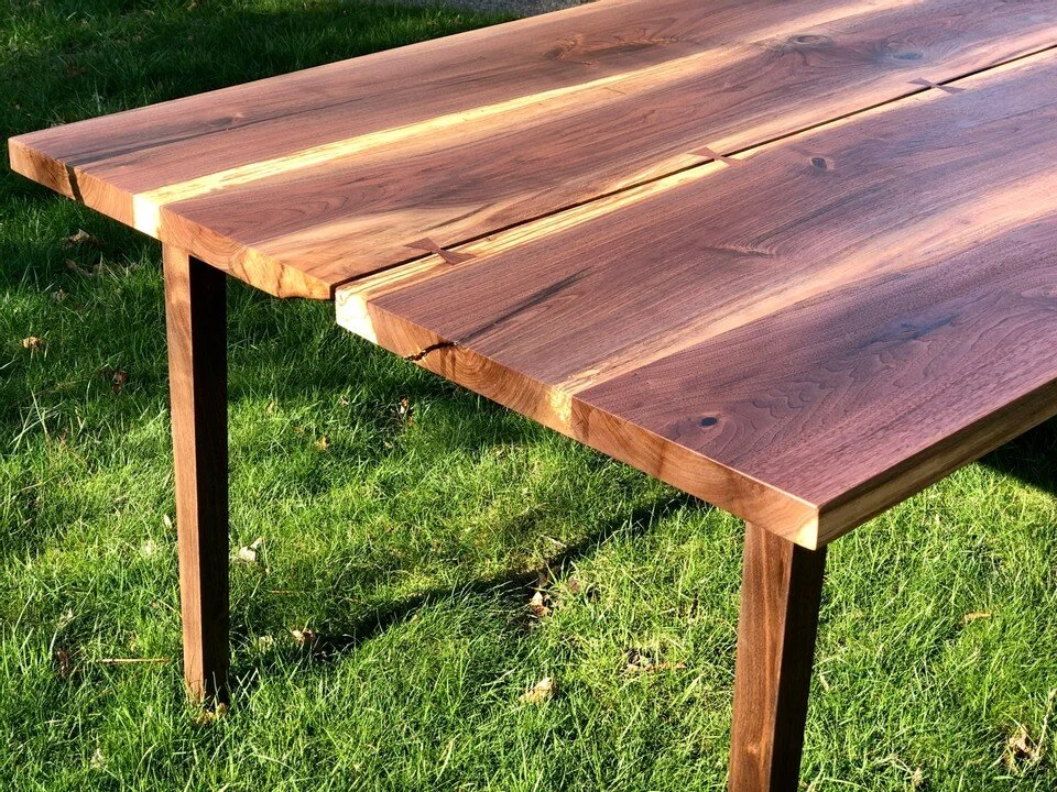 sleek walnut table with cracks and bow ties 