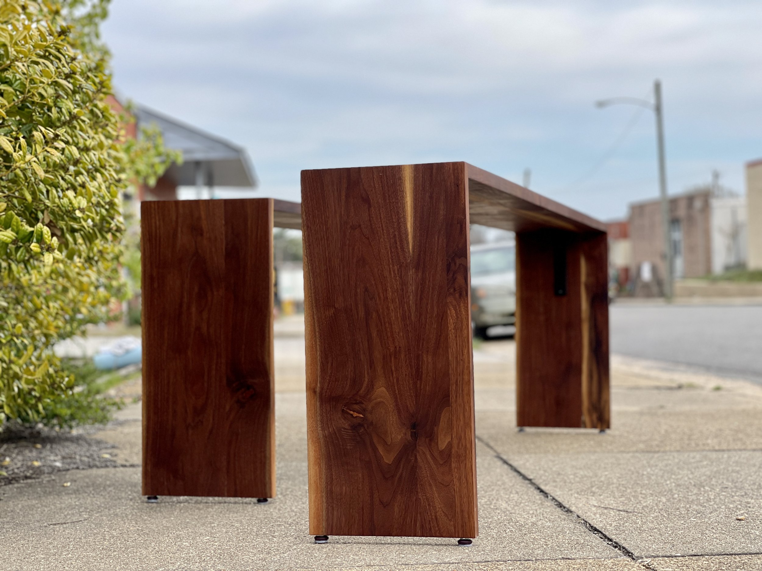Sallie Plumley Studio. Amazon HQ2 Custom Furniture Installation. Washington DC Arlington Virginia walnut sofa table with copper filled hidden dovetail joints 1