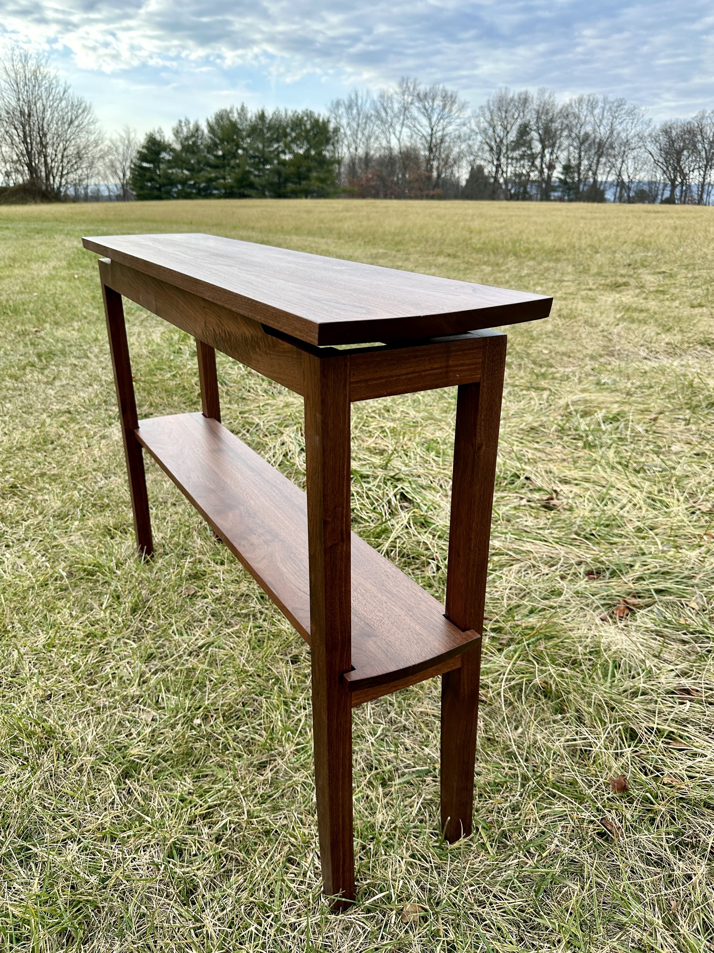 Sallie Plumley Studio. Richmond Virginia. walnut console table with curved legs. Sally Plumlee 