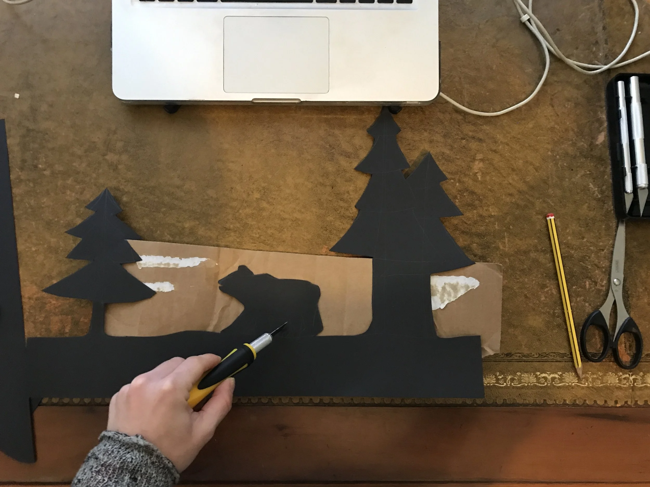 I drew out my Icelandic silhouette scene onto black card. I believe you can’t have light without dark. It adds contrast and is totally mesmerising. I used scissors and a craft knife to create the foreground.