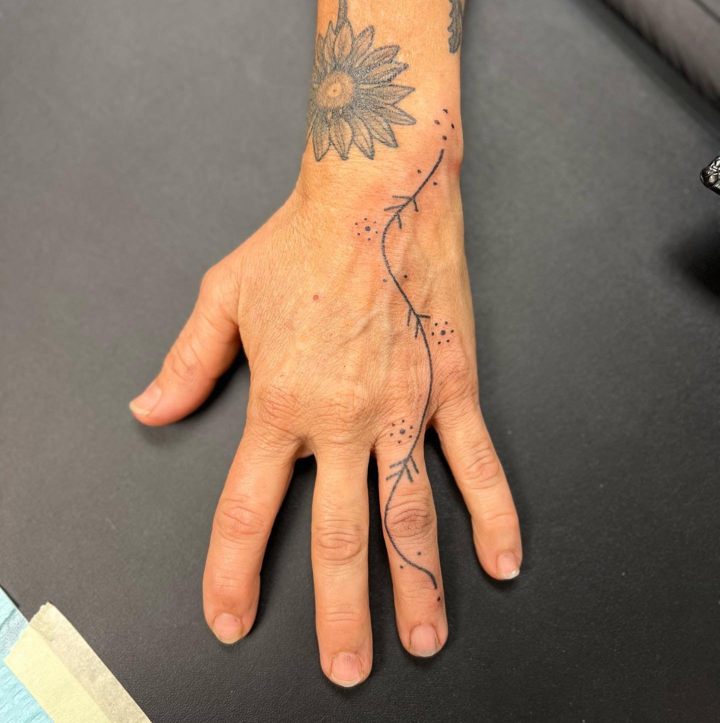 One drawn on. One from my flash. Both hand poked. May they bring you ease and continued abundance.