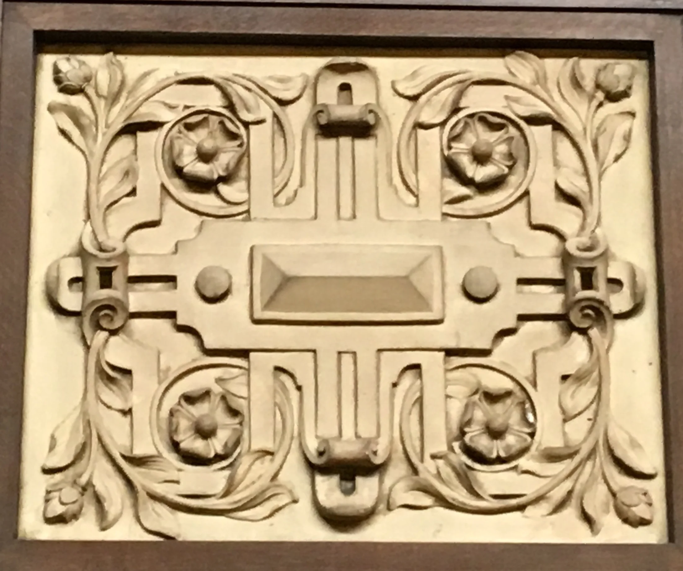 Tudor Rose featured in many Arts and Crafts interiors. This is part of plaster banding around the balcony.