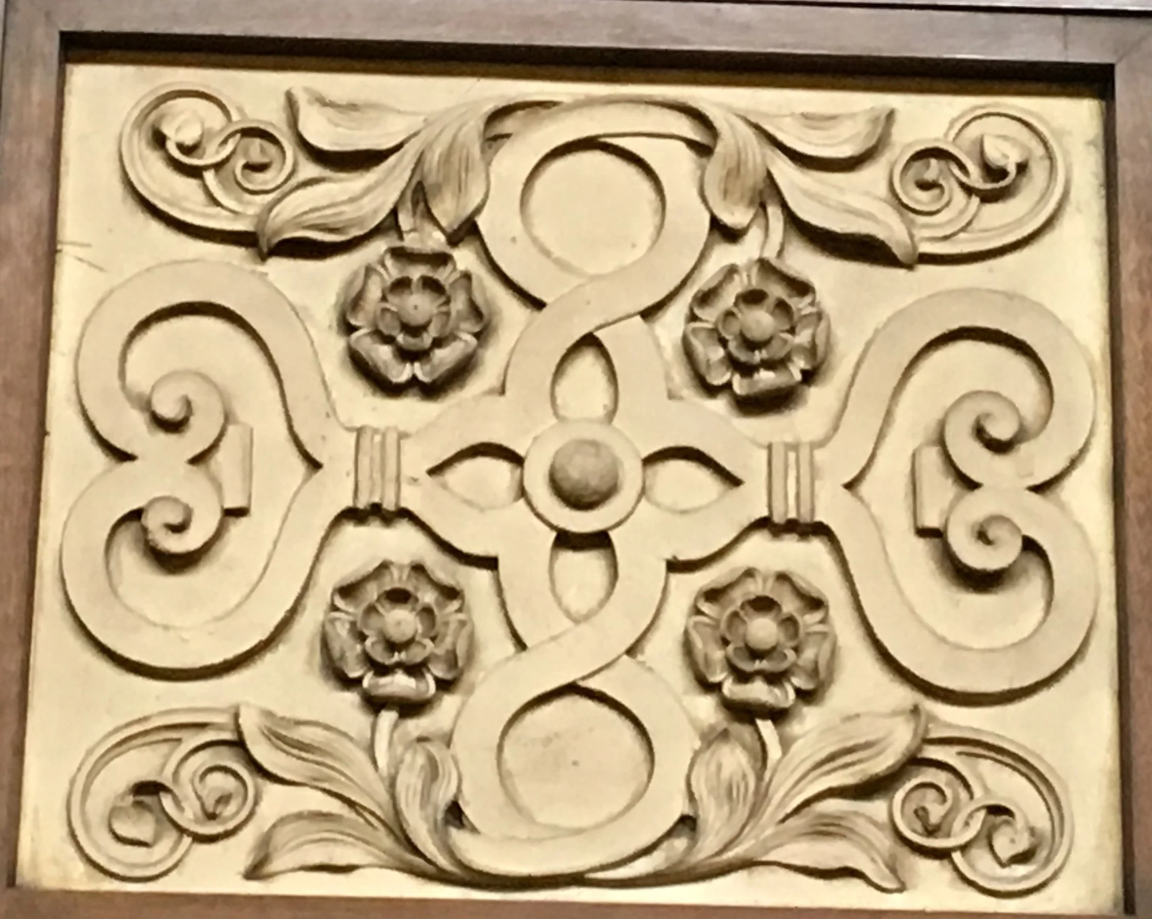 Tudor Rose motif featured in many Arts and Crafts interiors. This is part of the plaster banding around the balcony.