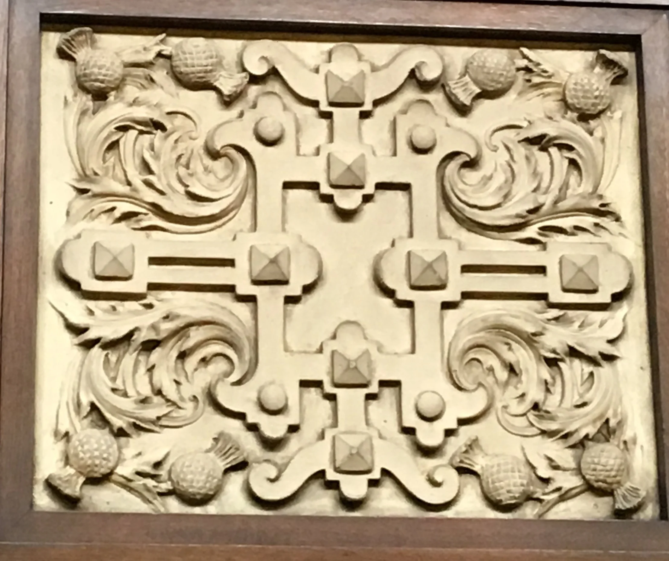 Thistle is a motif featured in many Arts and Crafts interiors. This is part of the plaster banding that goes around the balcony.