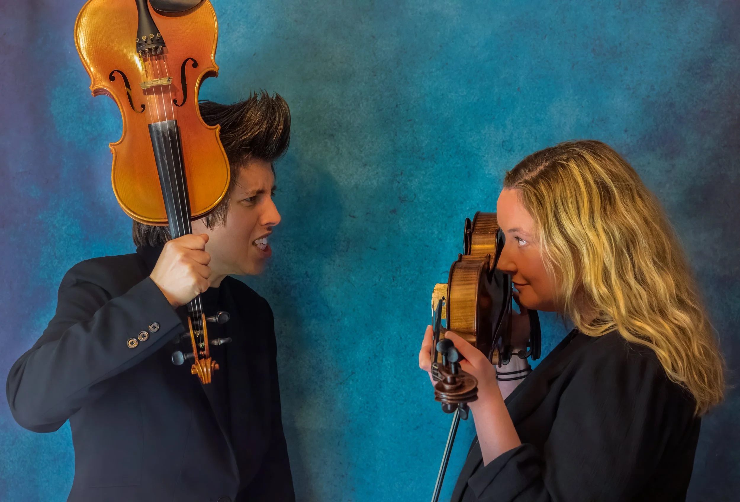 PIP AND ANTONIA WITH VIOLIN OVER HEAD OF PIP .jpg