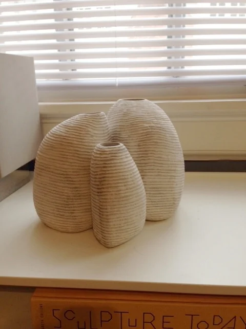 Limestone vases with chisel finish