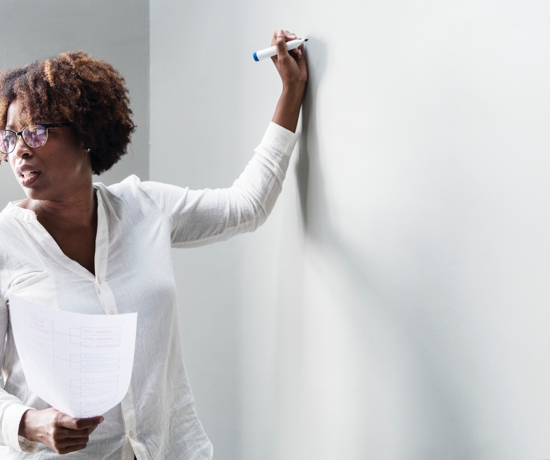 Optimized-woman at whiteboard.jpg