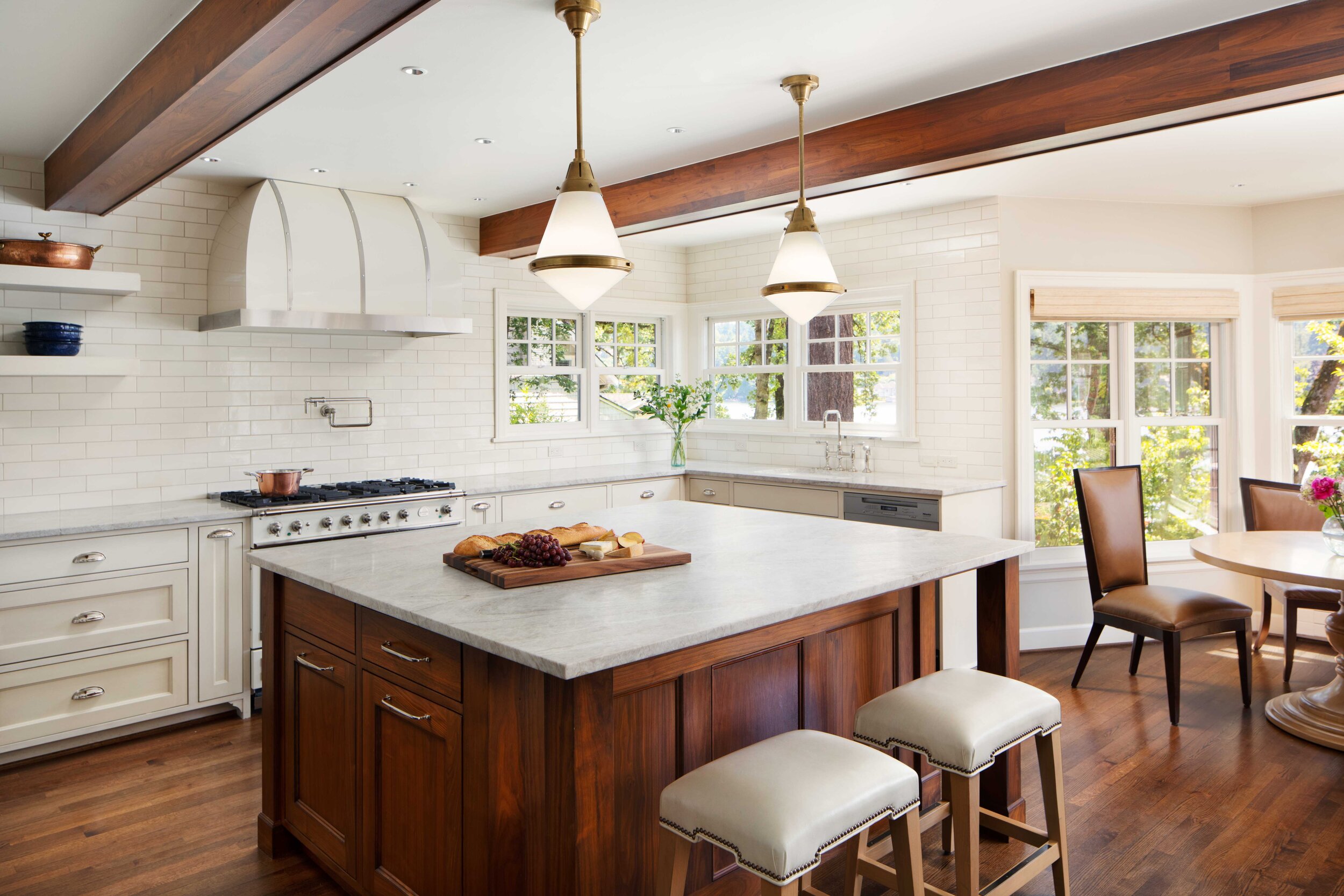 Timeless white kitchen renovation with traditional-style cabinets