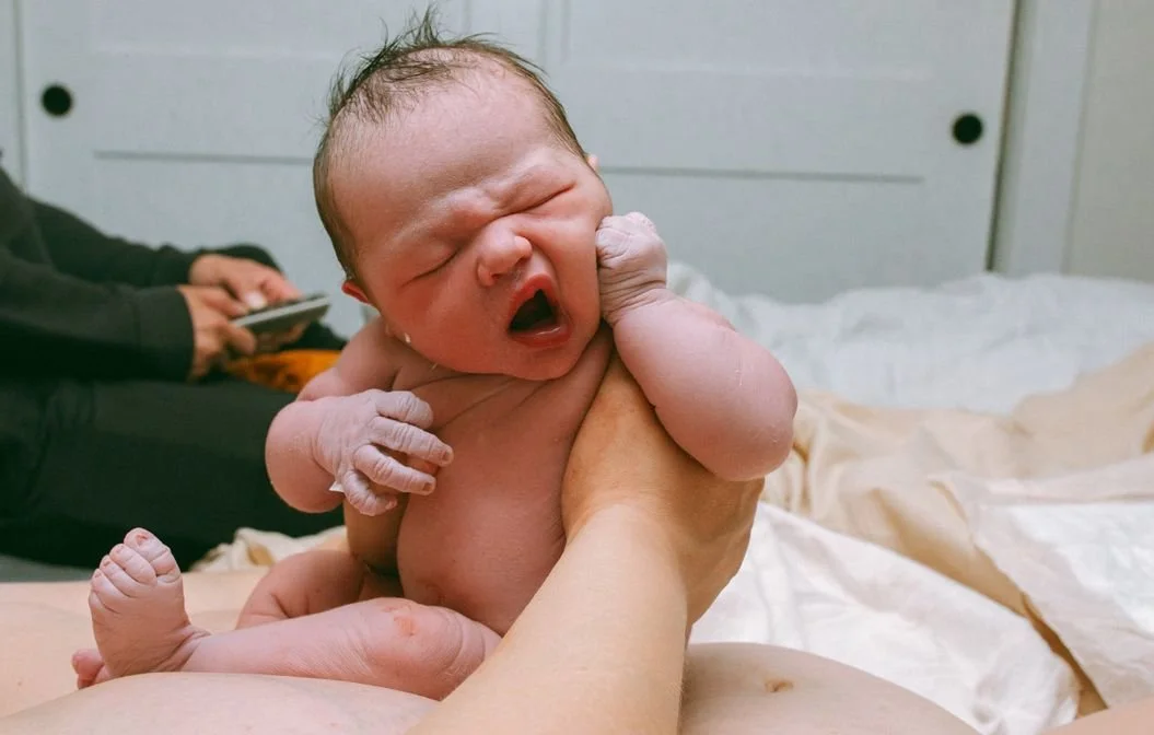 newborn baby yawning