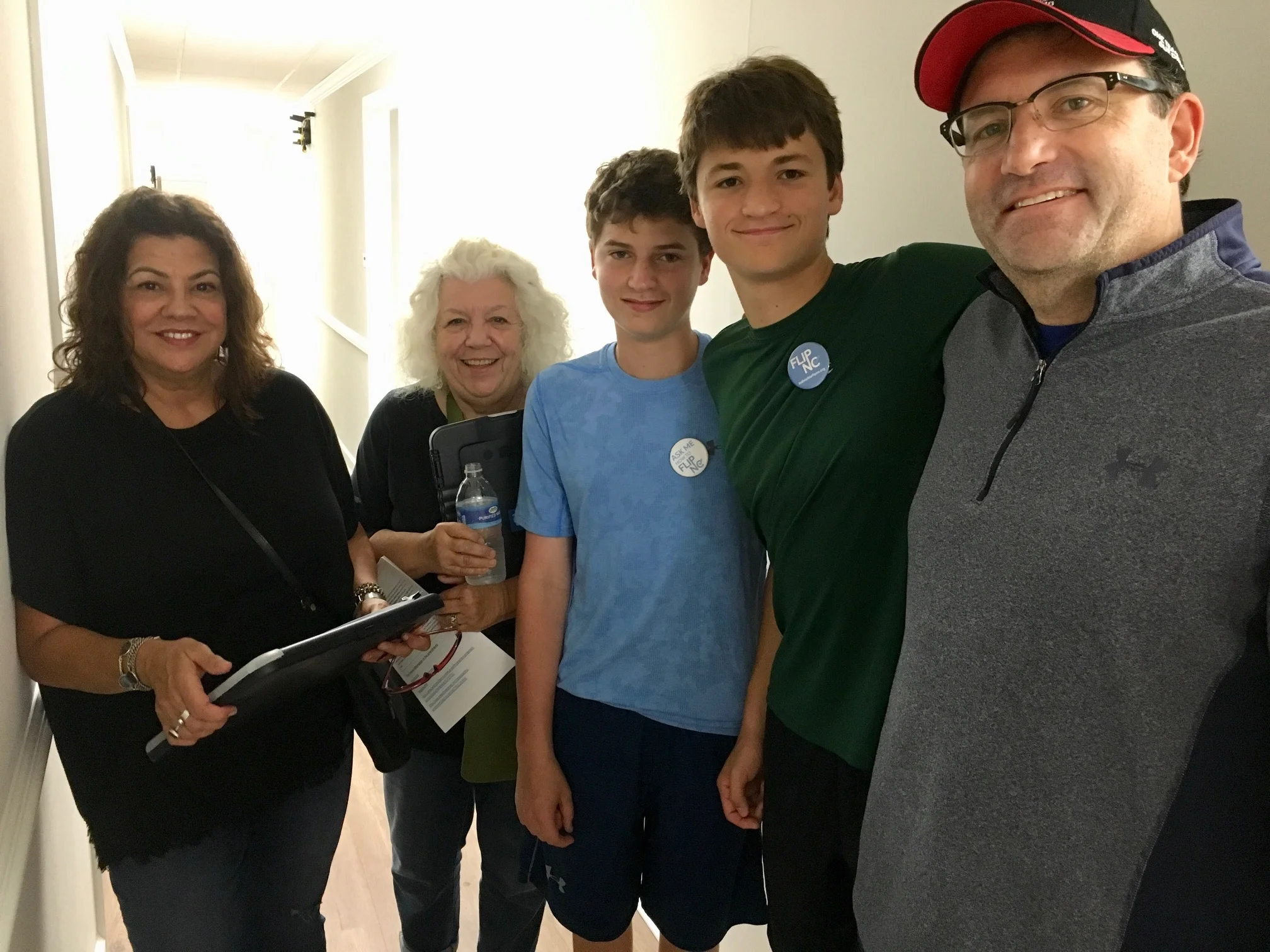 Canvassers Dana Carvalho and Nancy Spencer with Matt, Jake, and their dad