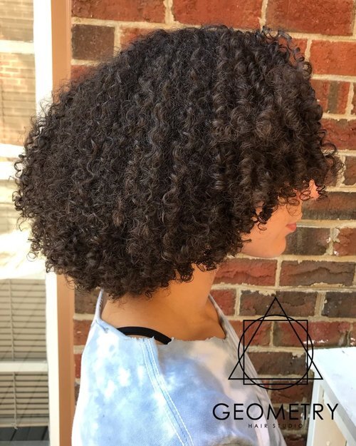 Thick Brown curly haircut and reshape