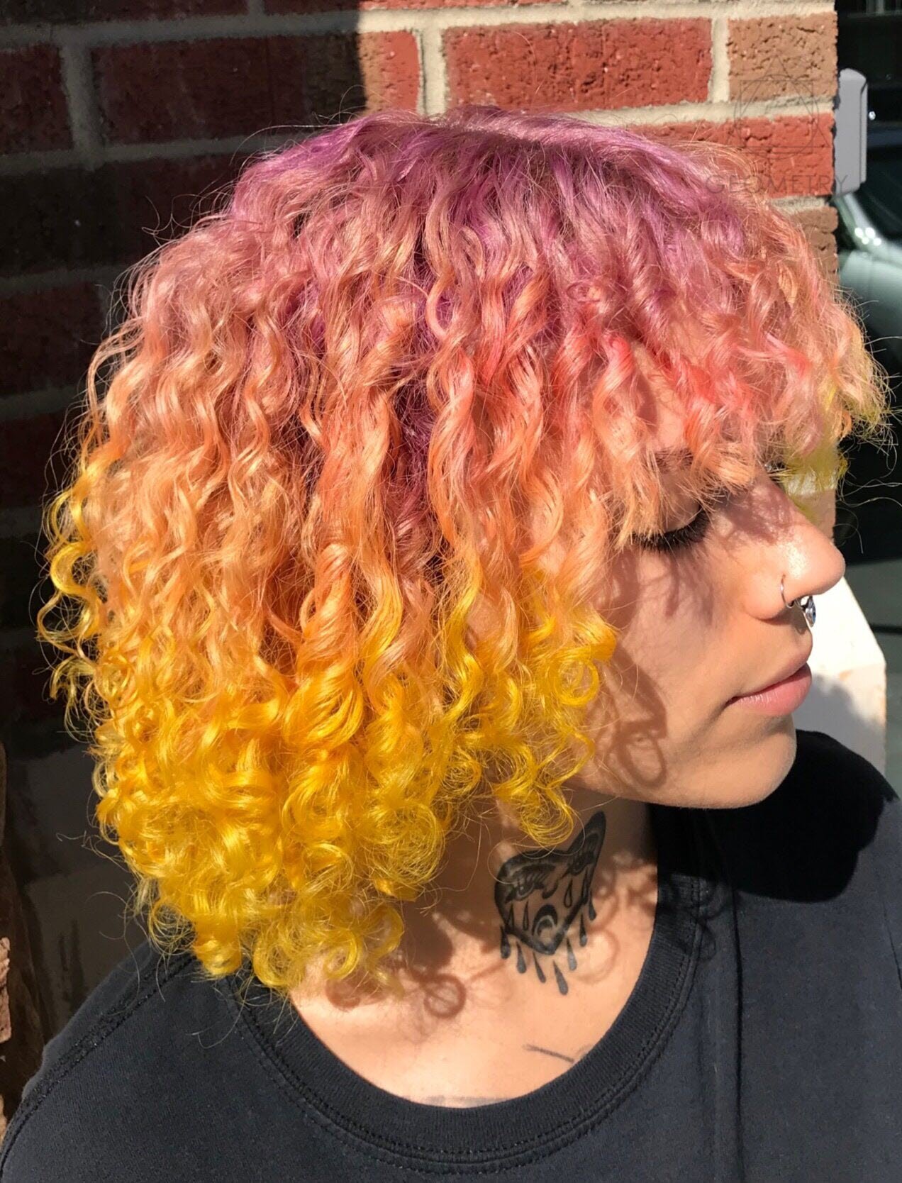 Pink to Orange color melt, custom curly hair color and cut