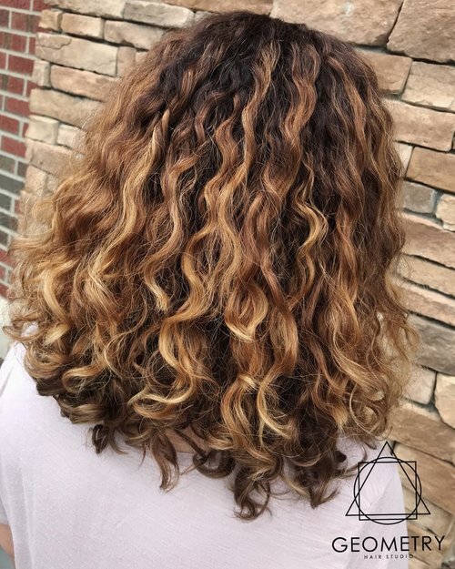 Full bodied wavy hair with brown to blonde balayage