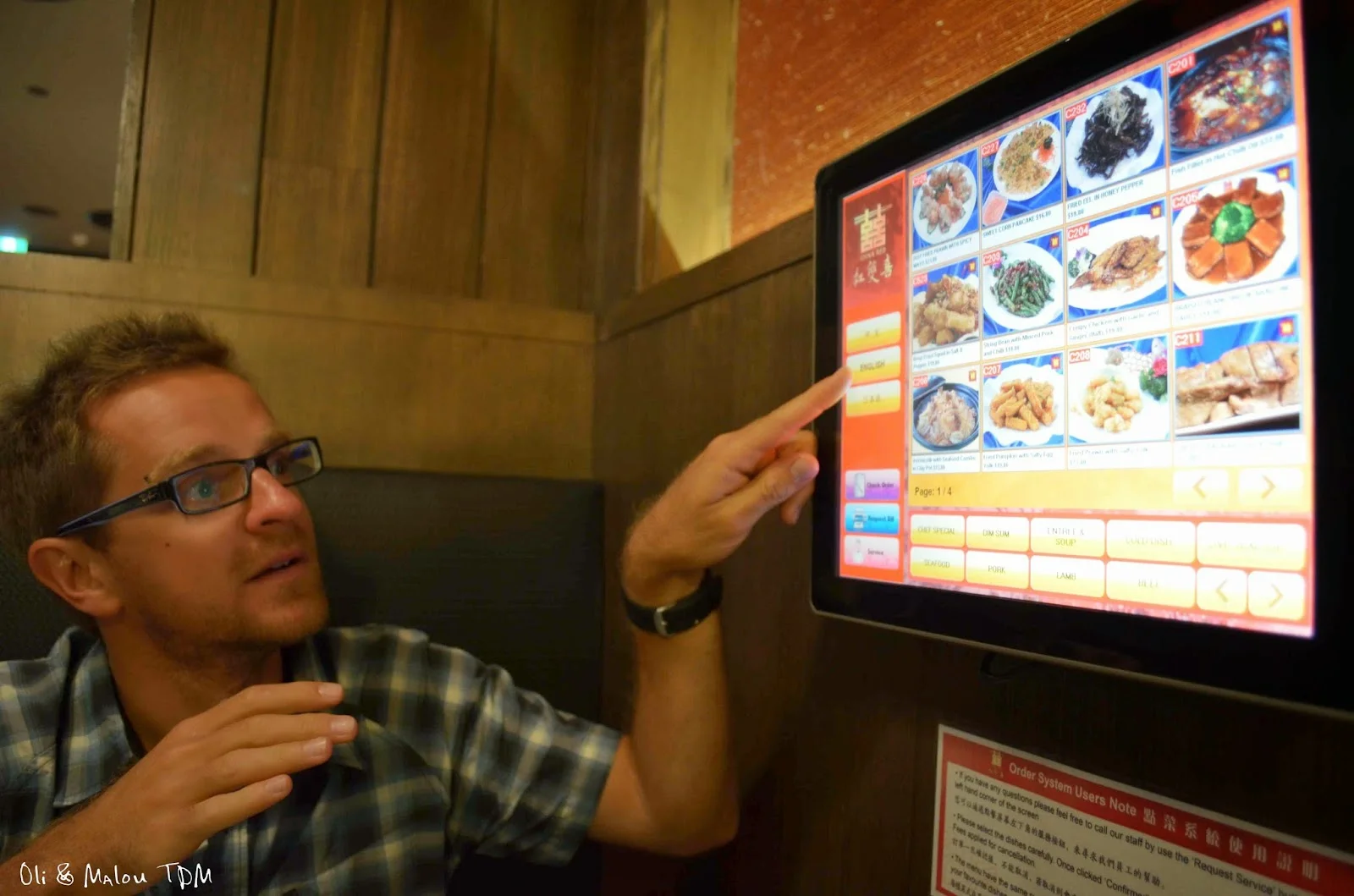 Oli excited to order food via touch screen at China Red. Image by Oli & Ma Lou.