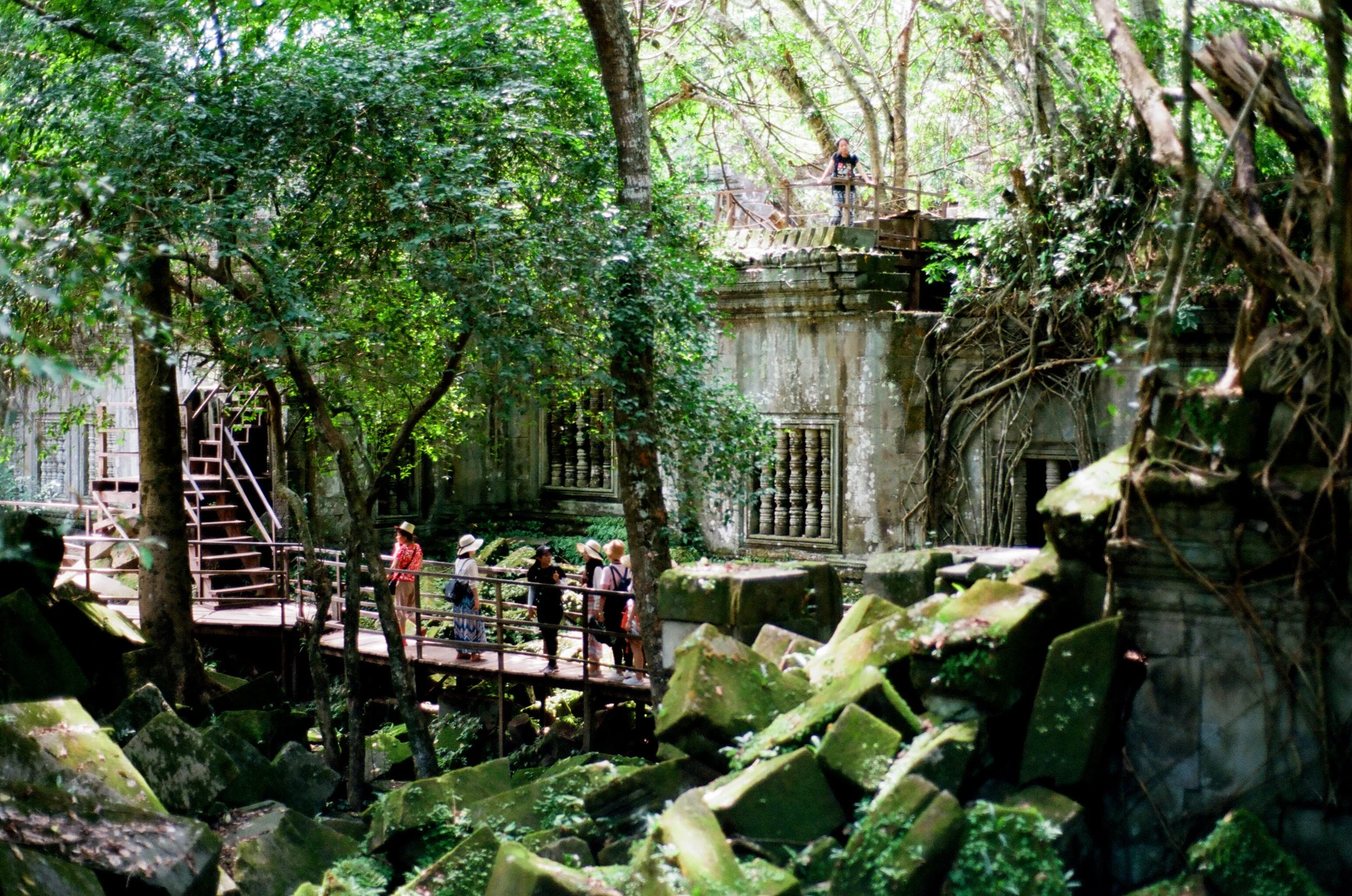Charlie Michael Photography | Award Winning City Photography | LinkedIn | BCG | 35mm Kodak Portra 400 Nikon | Tourists Looking Over The Ruins of Beng Mealea and Angkor Wat in Cambodia Ta Prohm.jpg