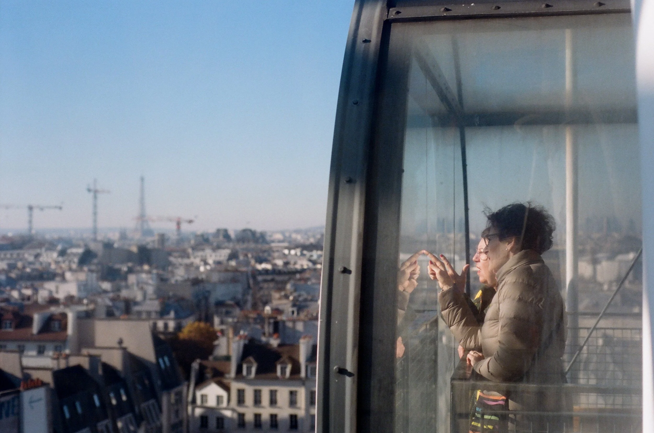 Charlie Michael Photography | Award Winning City Photography | LinkedIn | BCG | 35mm Kodak Portra 400 Nikon | Two Women Looking out at the Paris Skyline from the Pompidou Center in the French Capital.jpg