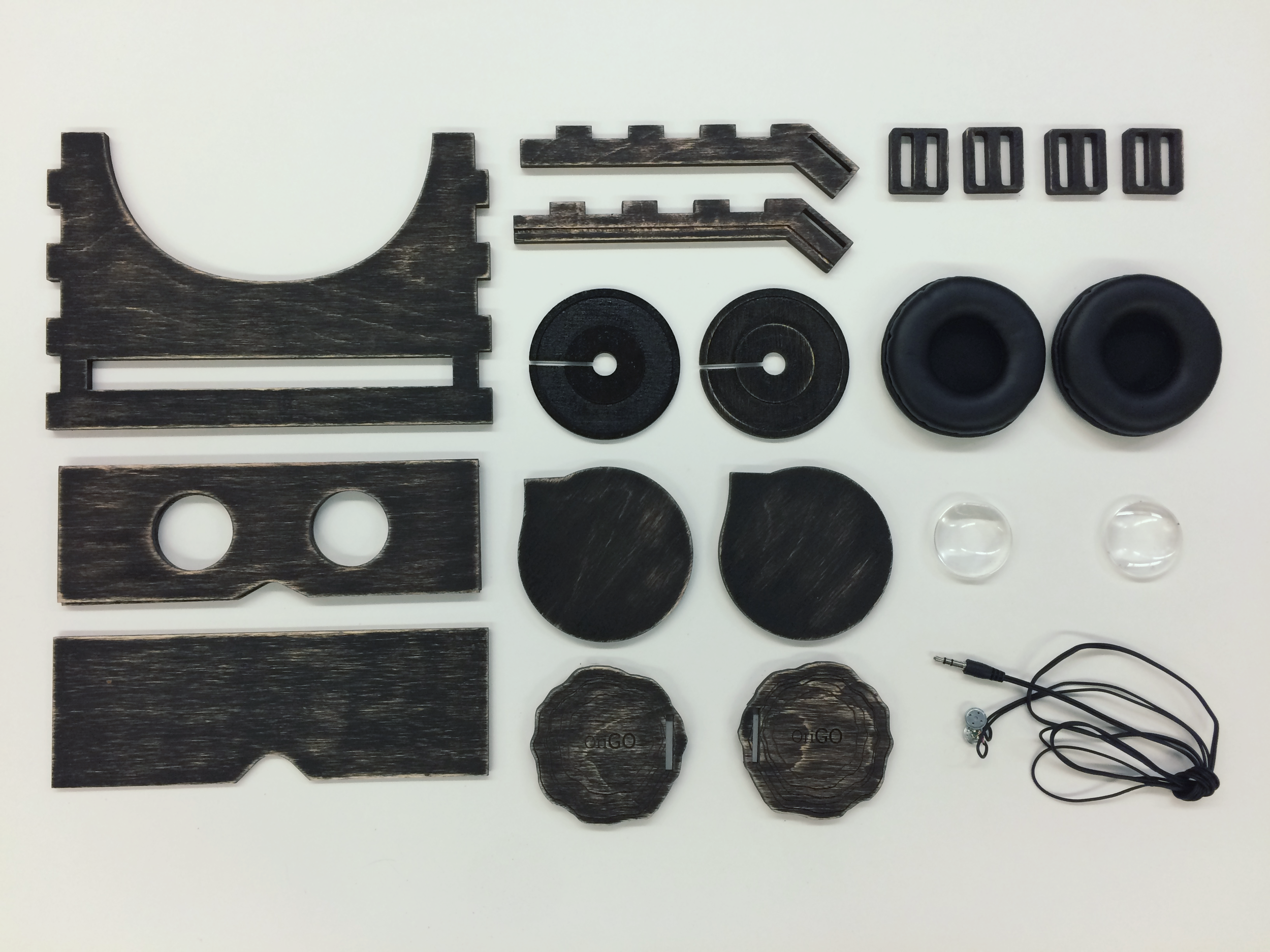 Laser-cut and stained components prior to assembly.