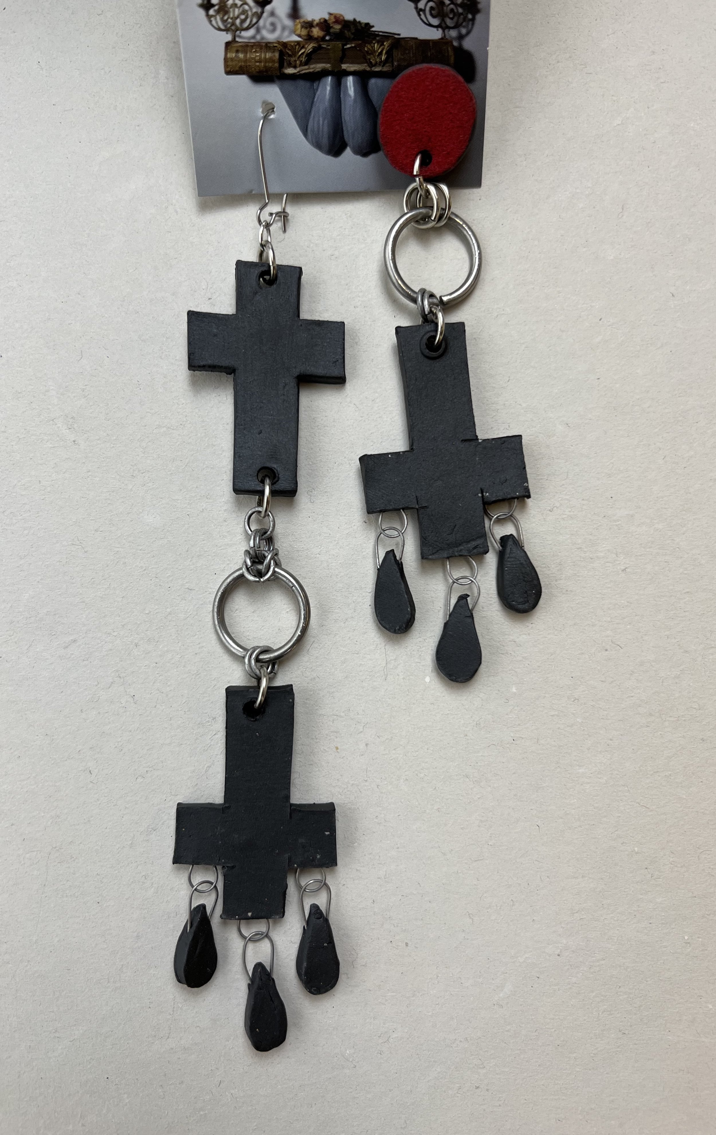 asymmetrical long black cross earrings 