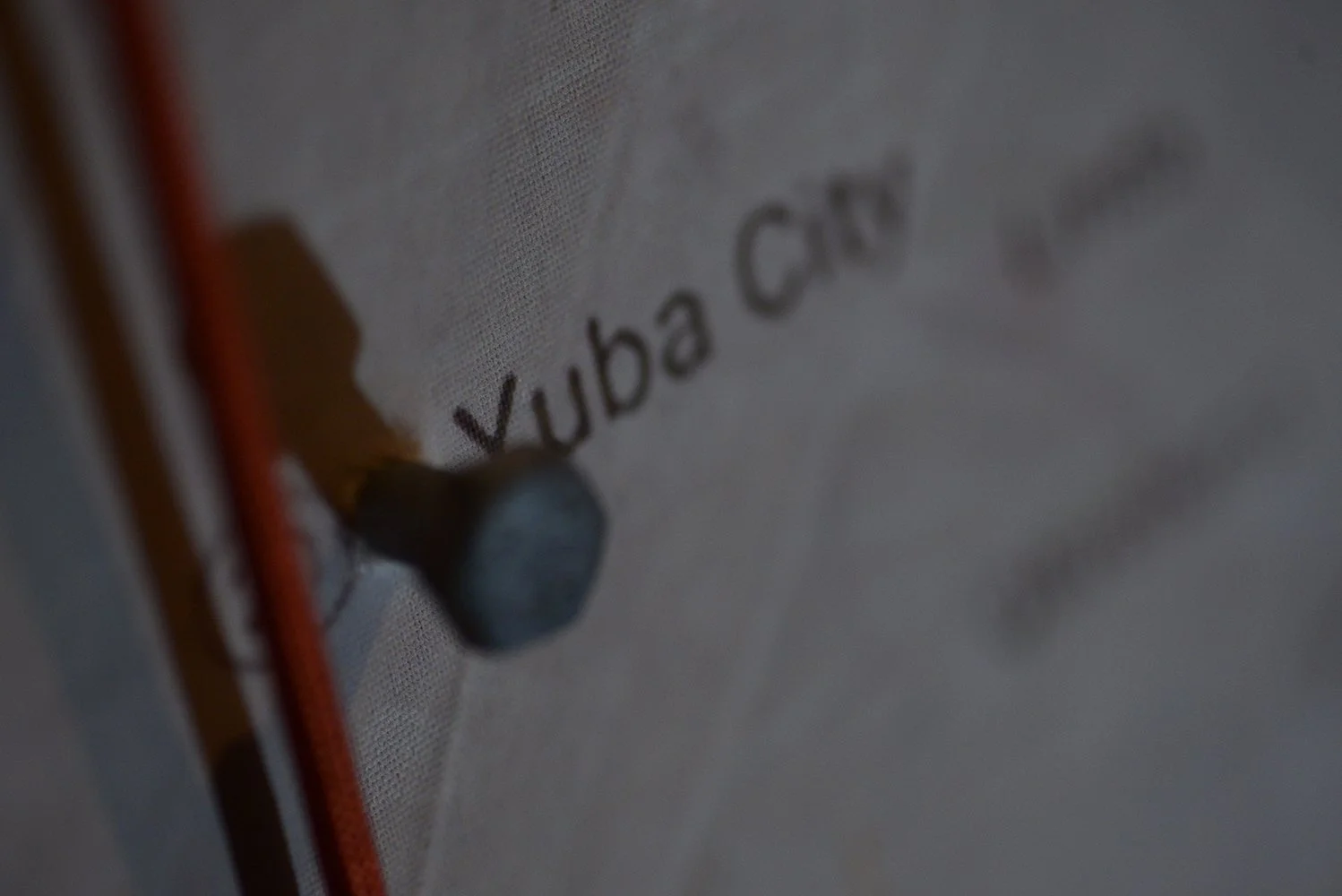 A local map displays Yuba City with a bolt and red string hanging next to it