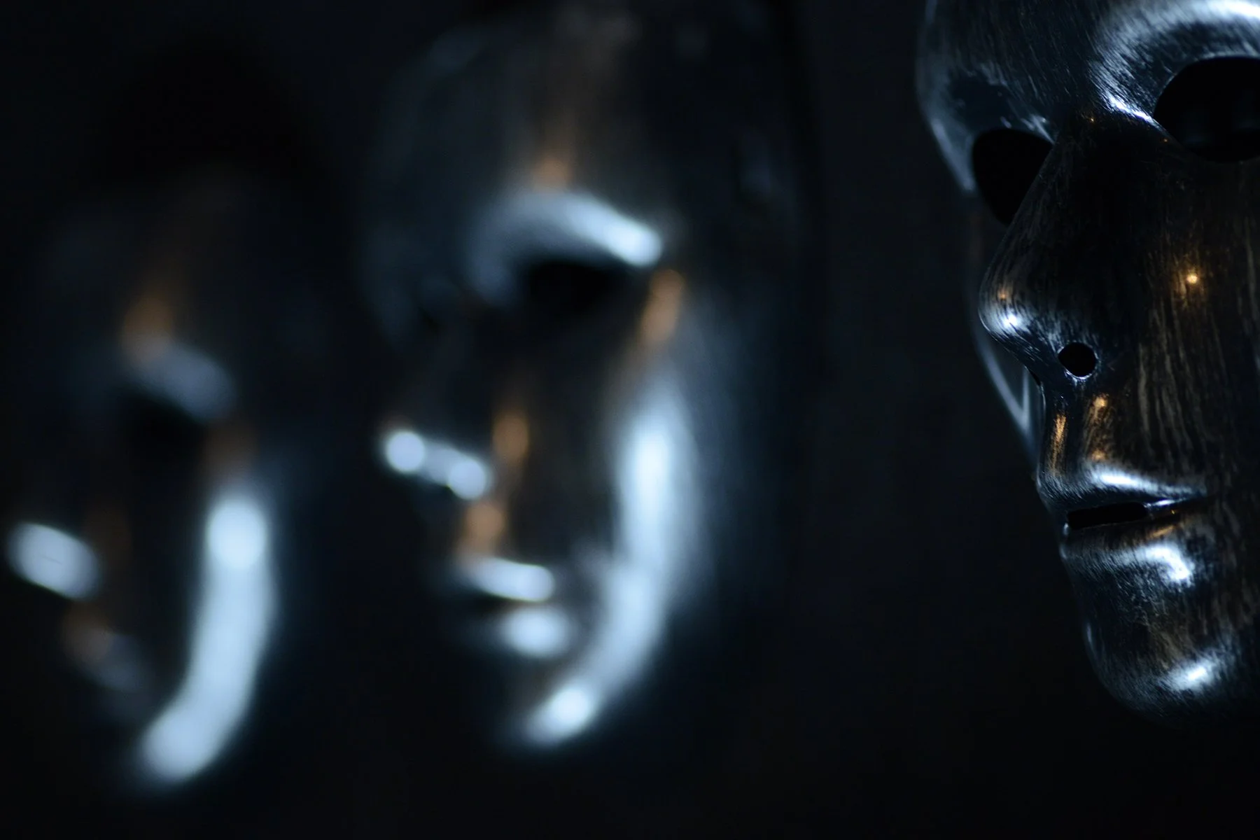 Silver masks hang on the wall in CONDEMNED2