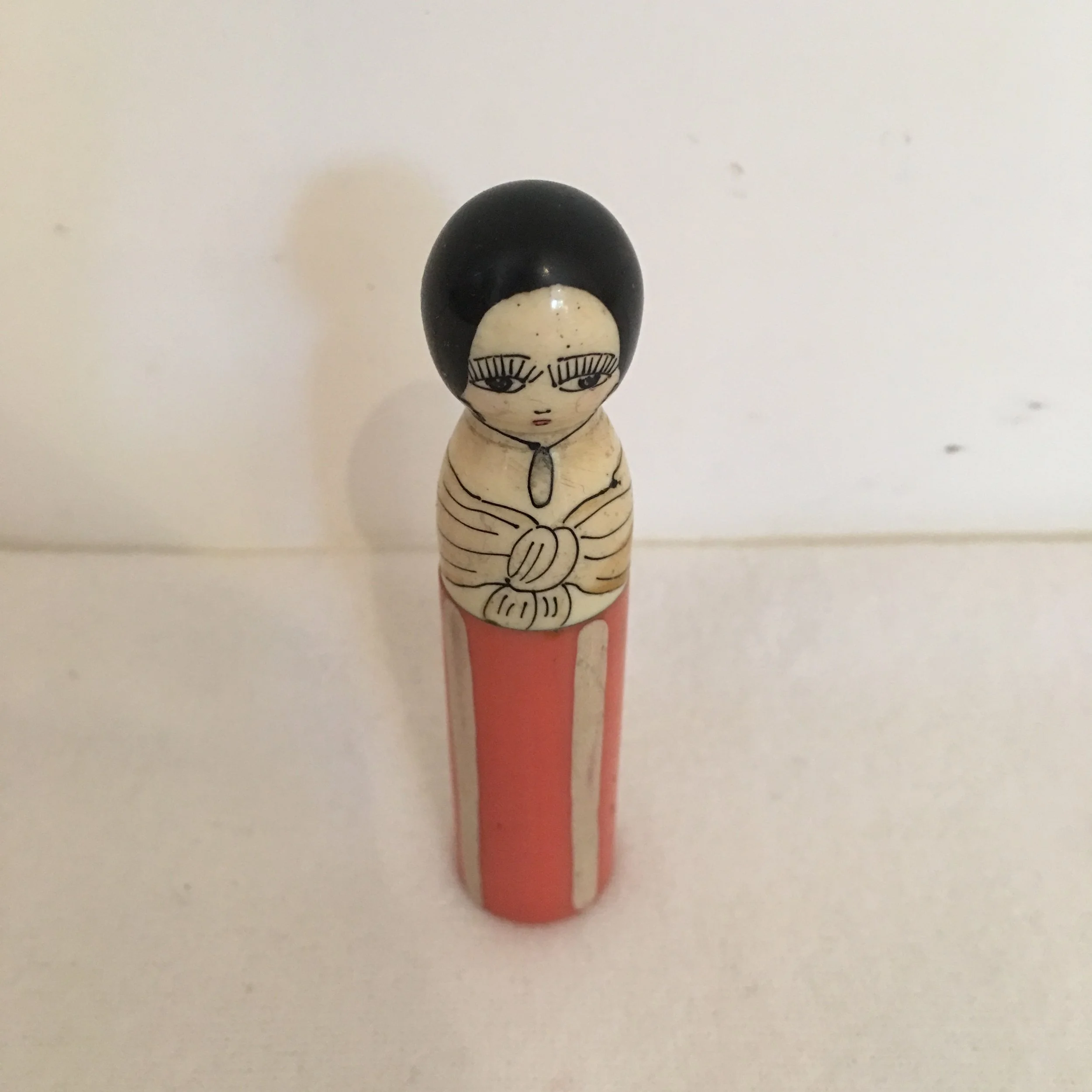 Bakelite perfume bottle holder in the shape of a woman, circa 1925