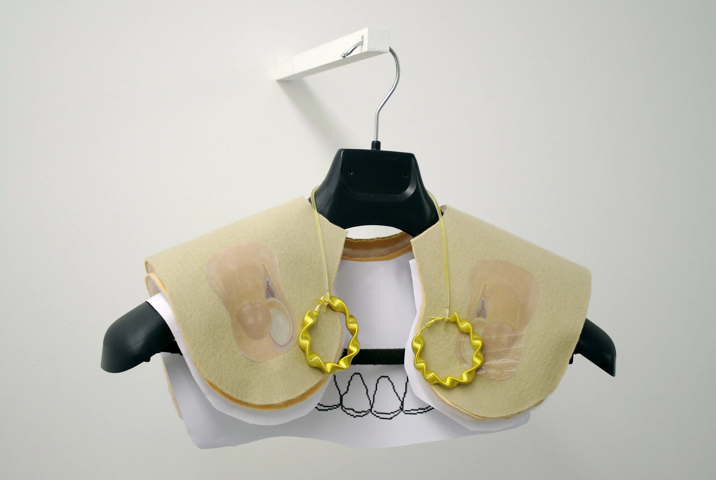 Bob Weight, 2011, Synthetic felt, Wadding, Digital print, Suit Hanger, Earings.