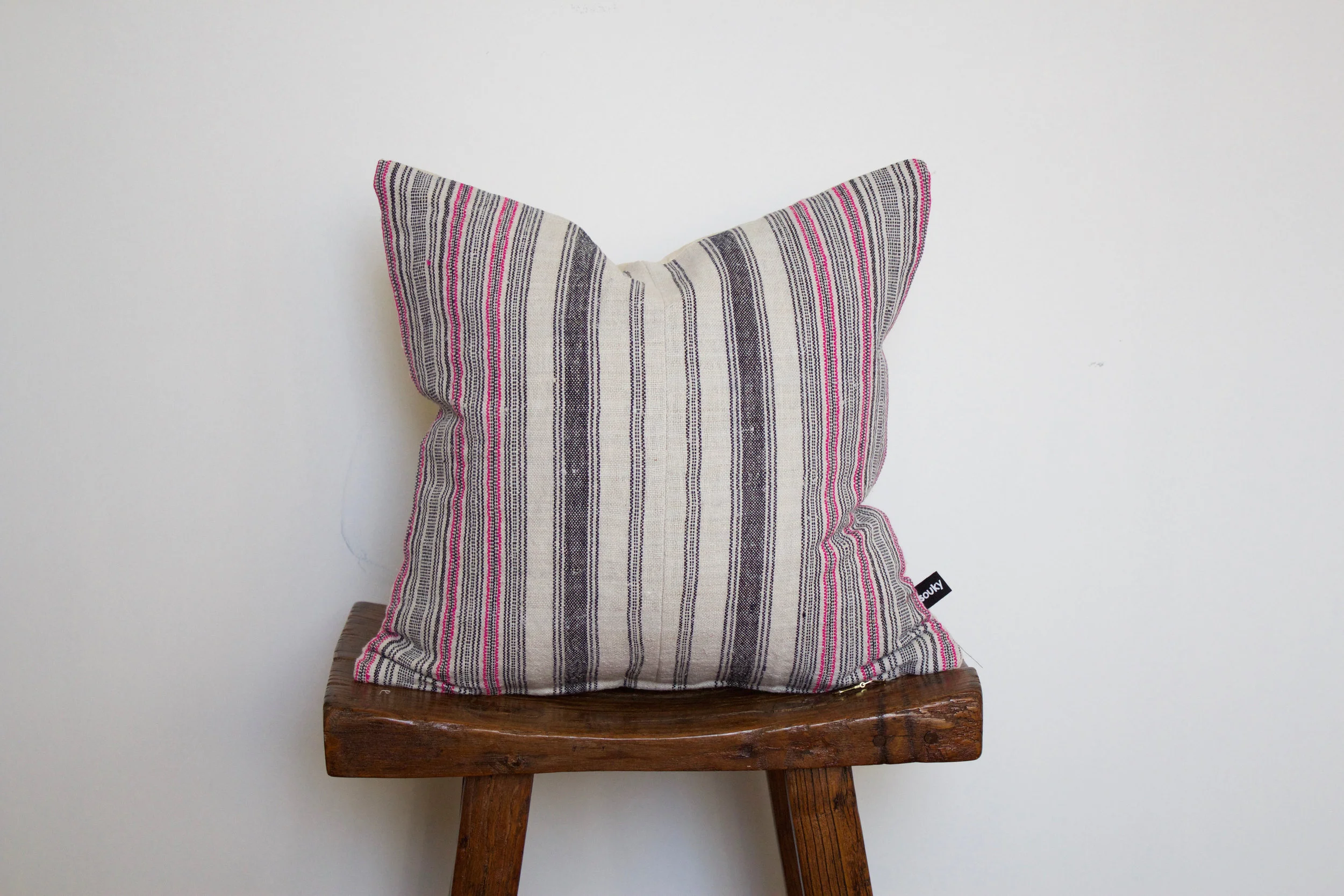 Finley - No. 143 275 RMB Pillow cover is made from handwoven hemp fabric sourced from Northern Thailand Size: Roughly 40x40 cm Pillow back is made from a neutral cotton/linen blend Zipper on bottom of pillow Down insert included Hand wash in cold water