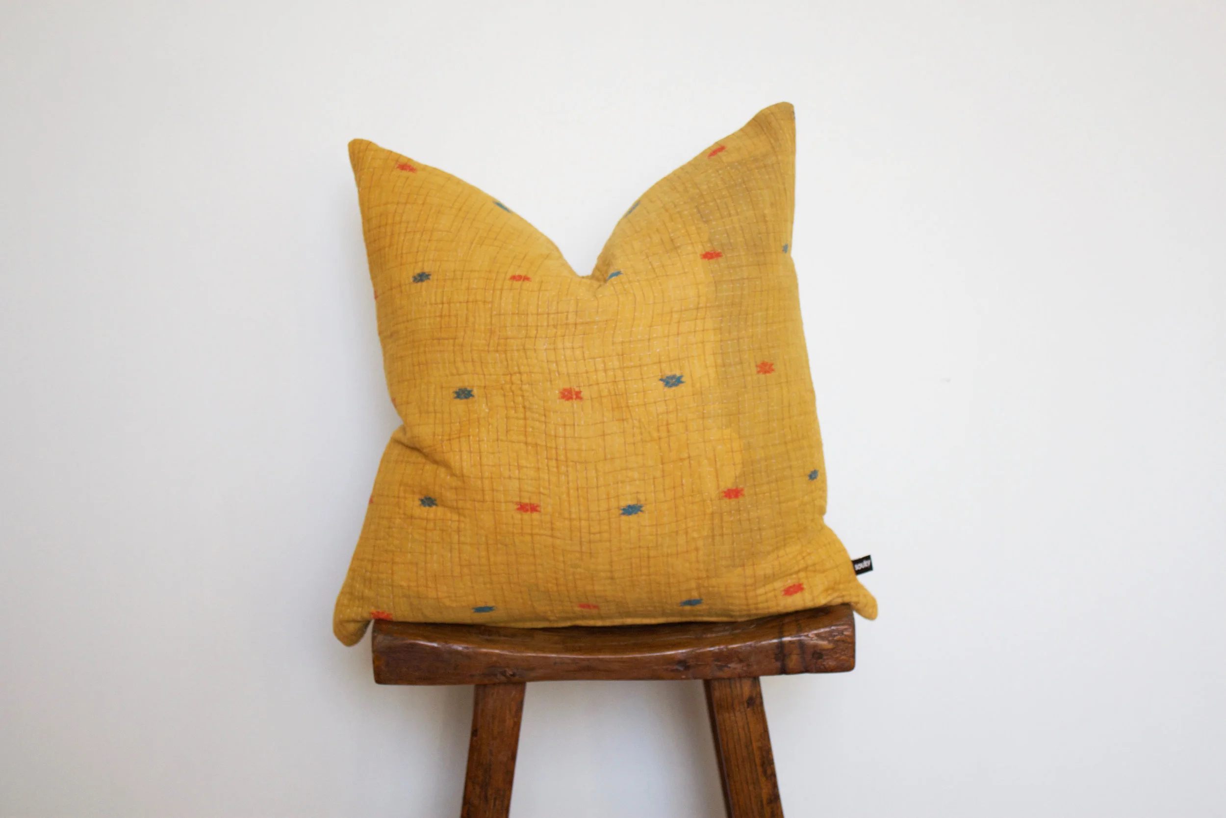 Mila - No. 214 300 RMB Pillow cover is made from worn sari fabric sourced from India Size: Roughly 50x50 cm Pillow back is made from a neutral cotton/linen blend Zipper on bottom of pillow Down insert included Dry clean only