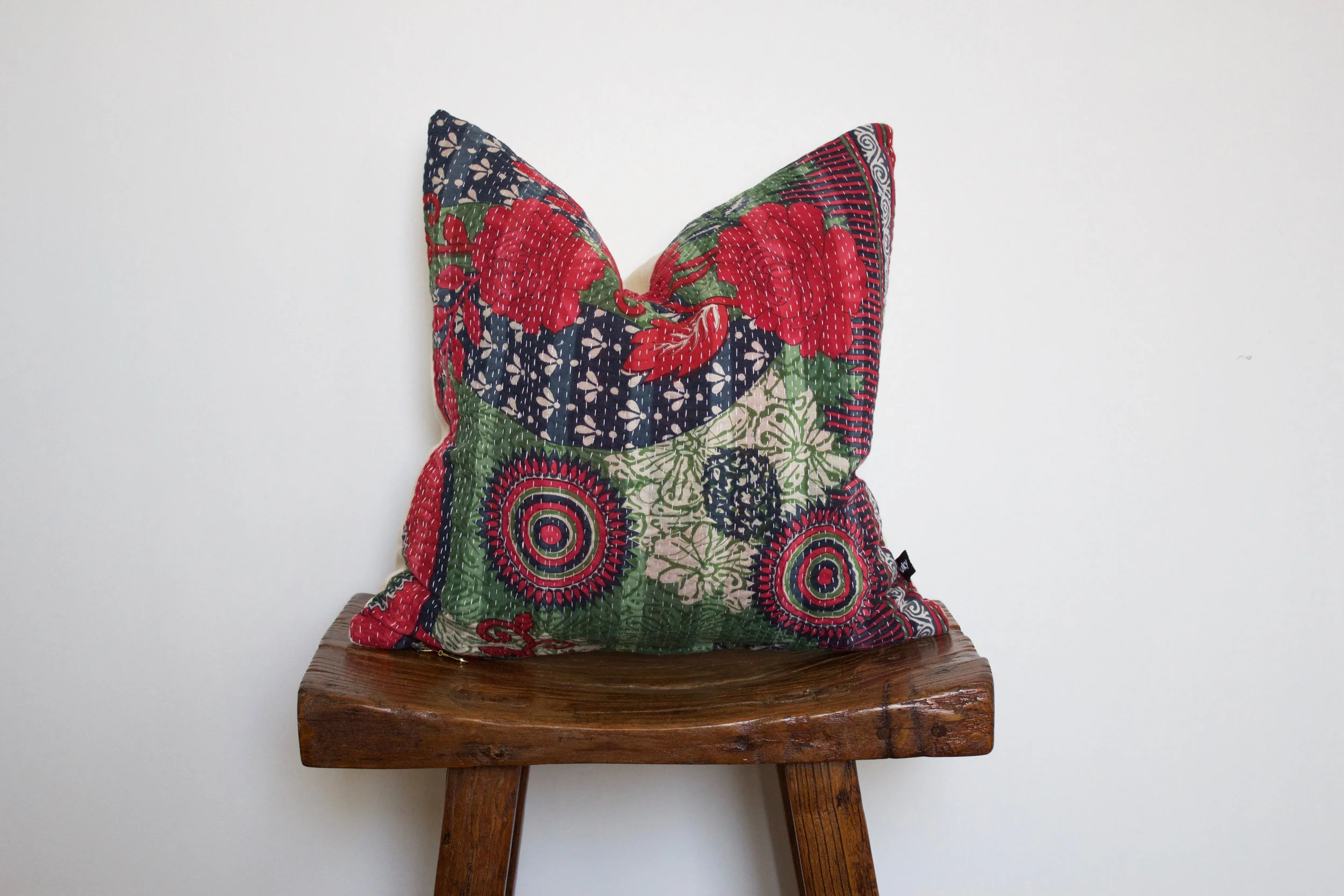 Holly - No. 238 220 RMB Pillow cover is made from worn sari fabric sourced from India Size: Roughly 40x40 cm Pillow back is made from a neutral cotton/linen blend Zipper on bottom of pillow Down insert included Dry clean only