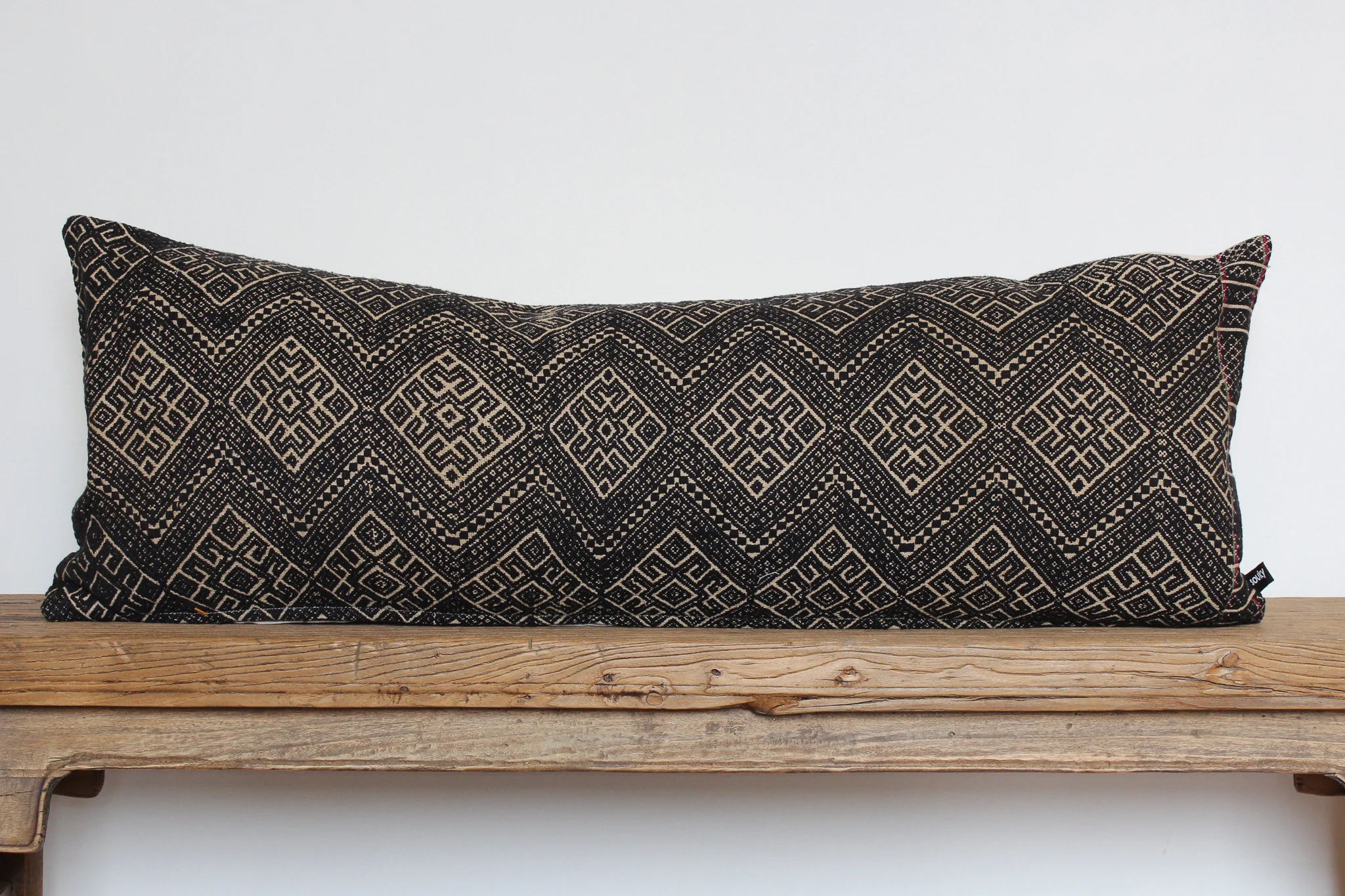 Reese - No. 301 400 RMB Pillow cover is made from embroidered fabric used in traditional wedding blankets in southern China Size: Roughly 83x31 cm Pillow back is made from a neutral cotton/linen blend Brass zipper on bottom of pillow Down insert included Hand wash and spot treat