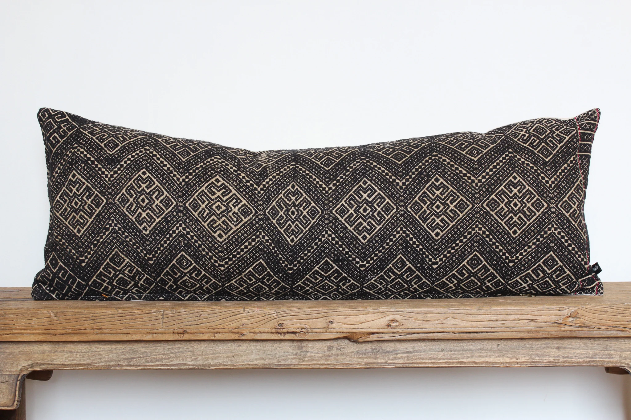 Reese - No. 302 400 RMB Pillow cover is made from embroidered fabric used in traditional wedding blankets in southern China Size: Roughly 83x31 cm Pillow back is made from a neutral cotton/linen blend Brass zipper on bottom of pillow Down insert included Hand wash and spot treat