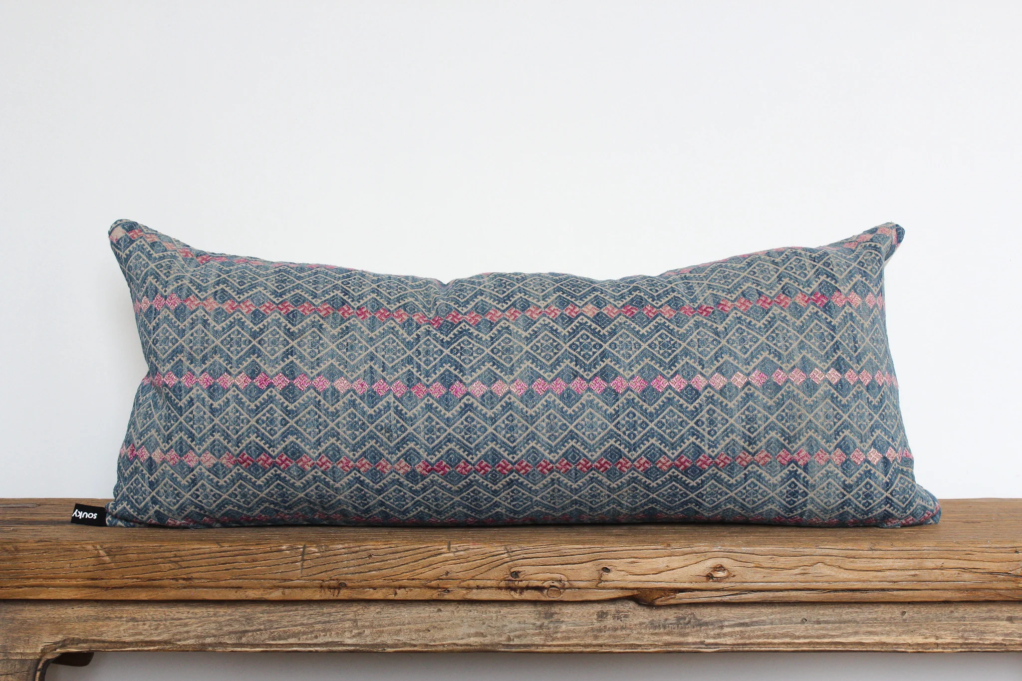 Ariel - No. 504 400 RMB Pillow cover is made from embroidered fabric used in traditional wedding blankets in southern China Size: Roughly 29x69 cm Pillow back is made from a neutral cotton/linen blend Zipper on bottom of pillow Down insert included Hand wash and spot treat