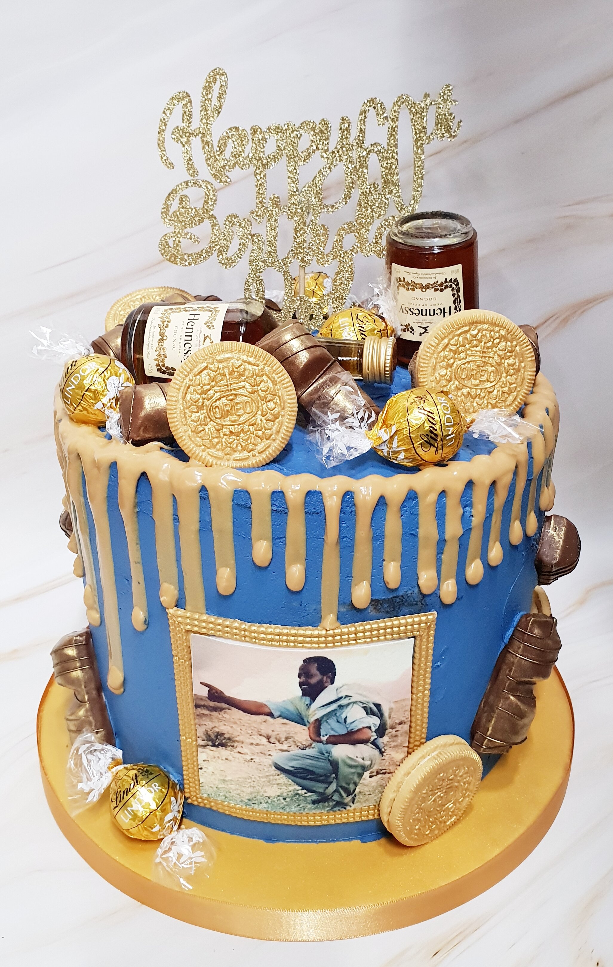 blue and gold drip cake.jpg