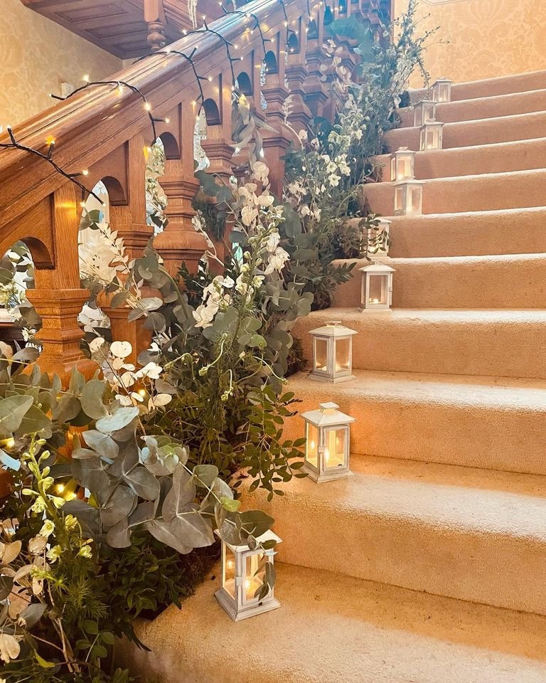 Starborough Manor Foliage and candle stairs.jpg