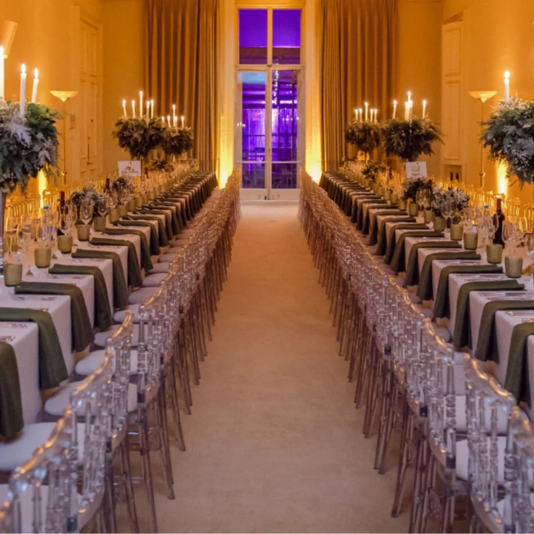 Kent House Knightsbridge long tables, ghost chairs, dark green napkins.jpg