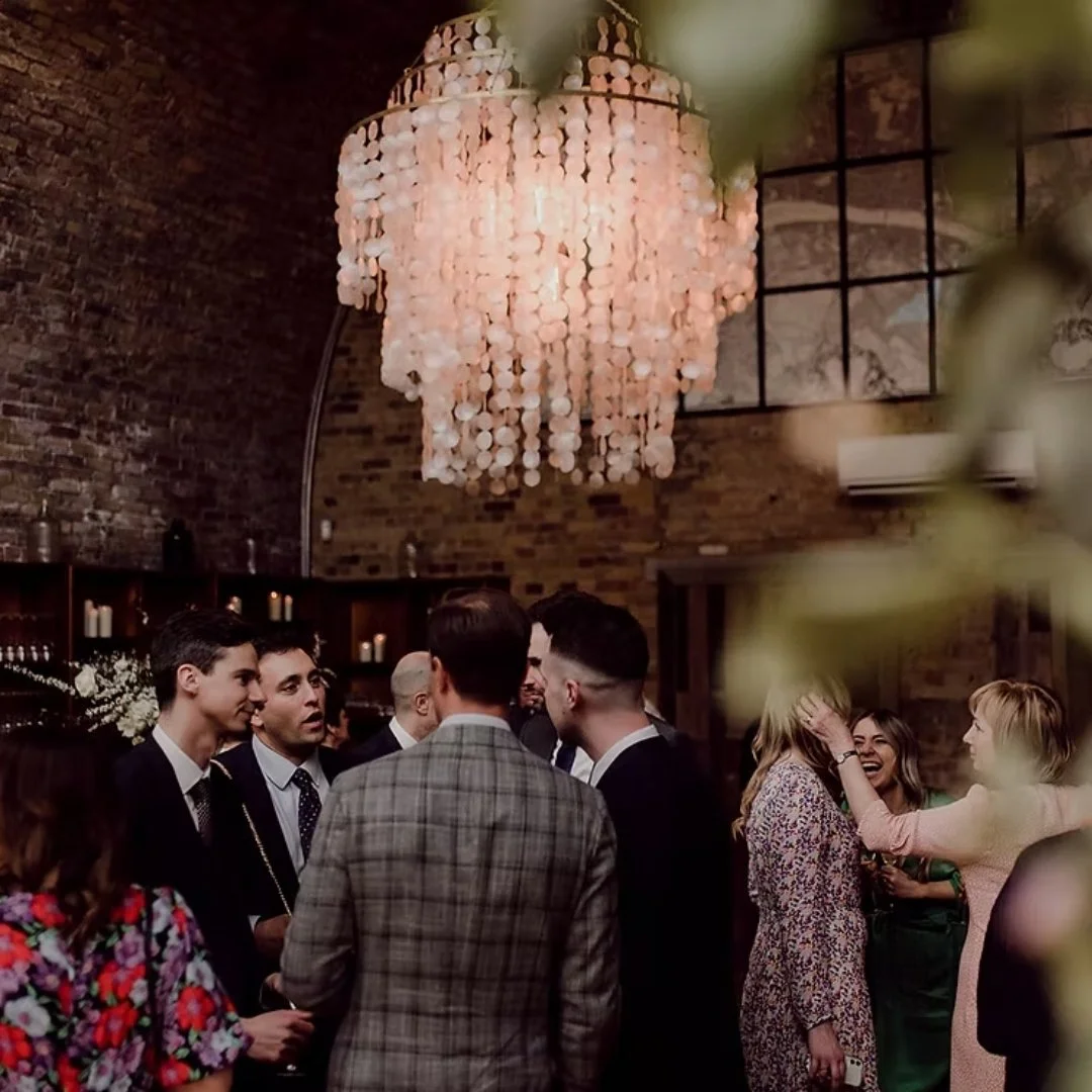 100 Barrington guests with chandelier.jpg