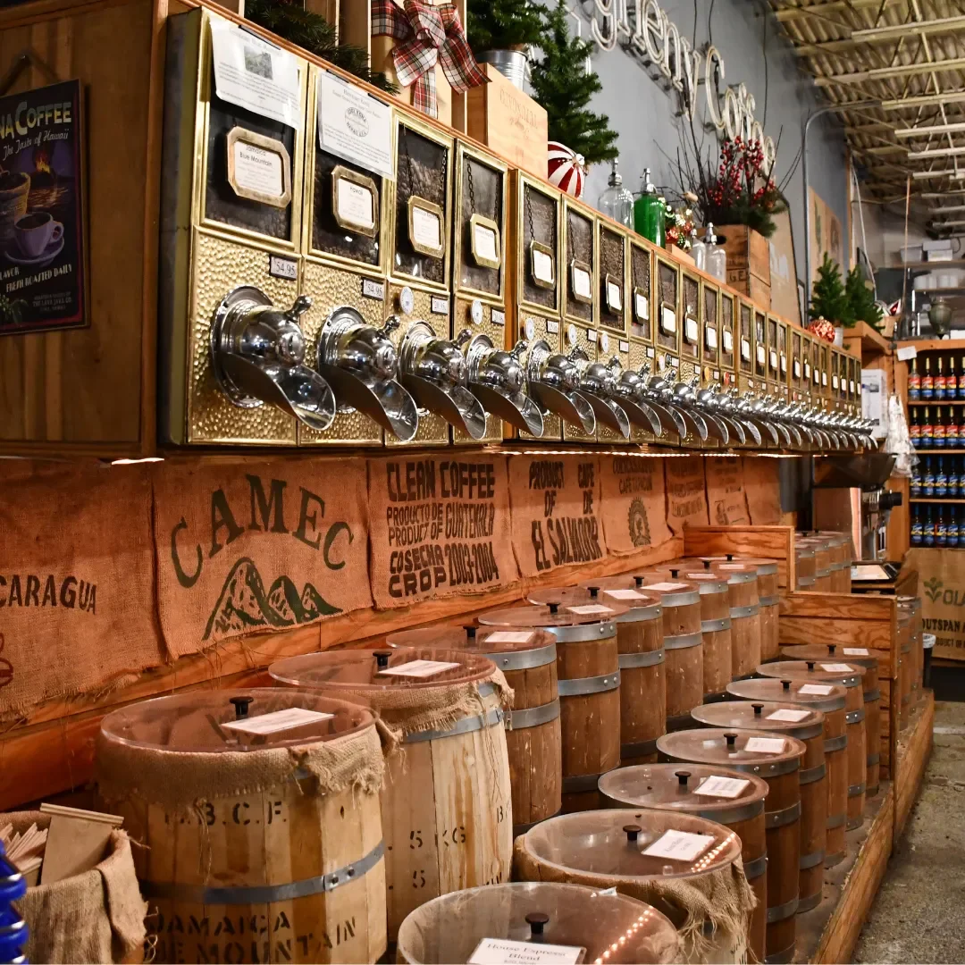 coffee bean barrels and selection inside of Allegheny Coffee in the Strip District in Pittsburgh, PA