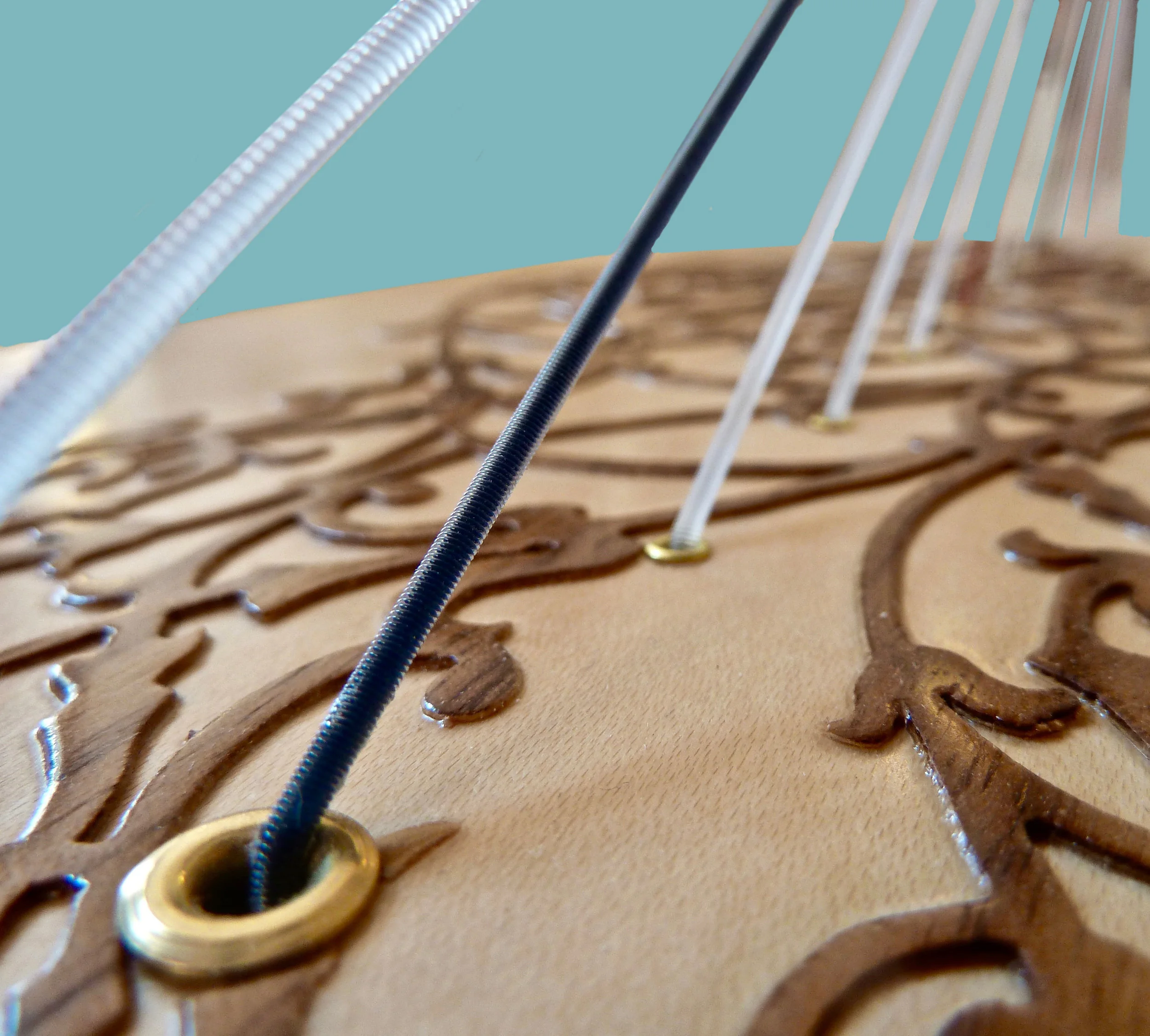 A Rees poplar soundboard with a maple veneer and walnut ornamentation.