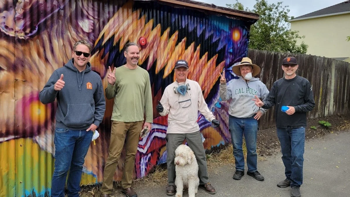 Volunteers give Jeronimus Alley a clear coat