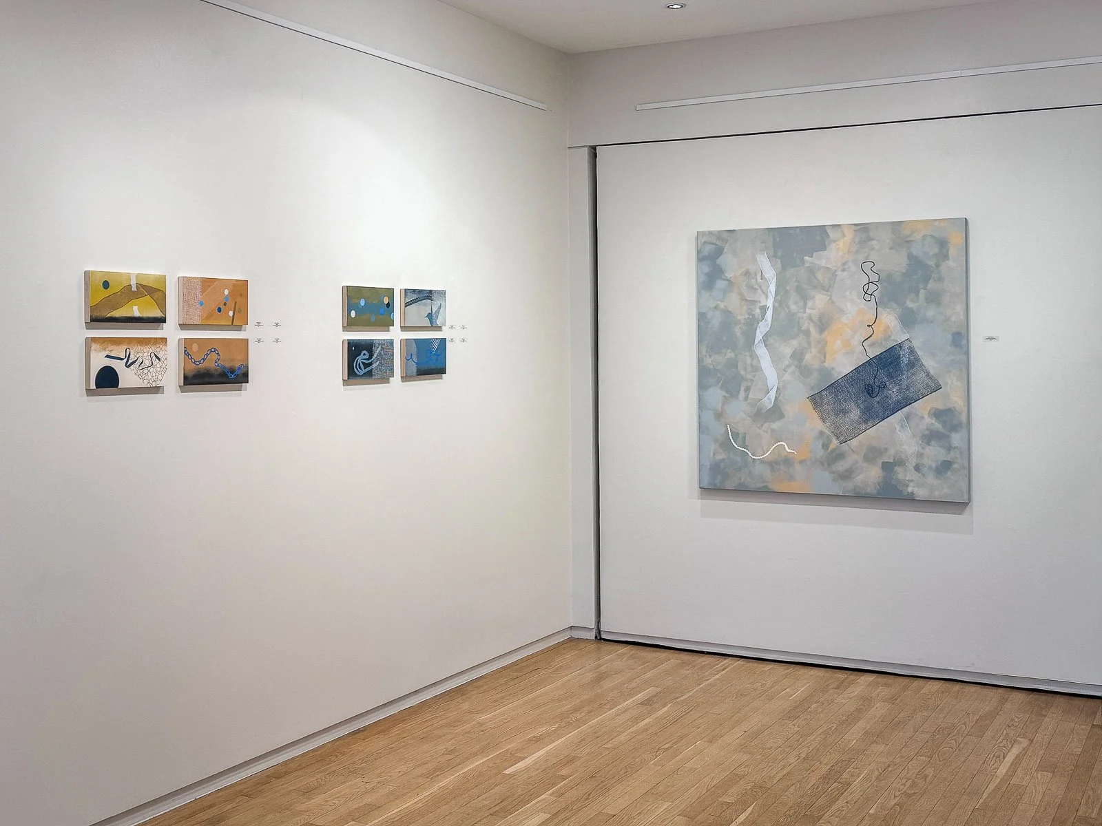 Abstract screenprints over acrylic on canvas and wood panels on gallery walls