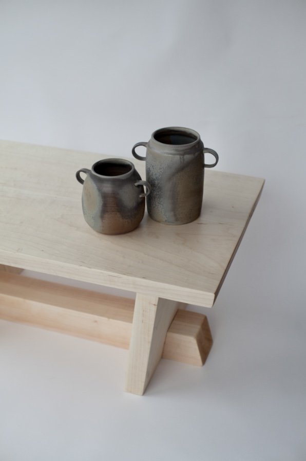  Solid maple Nakashima style coffee table with wood fired urns. 