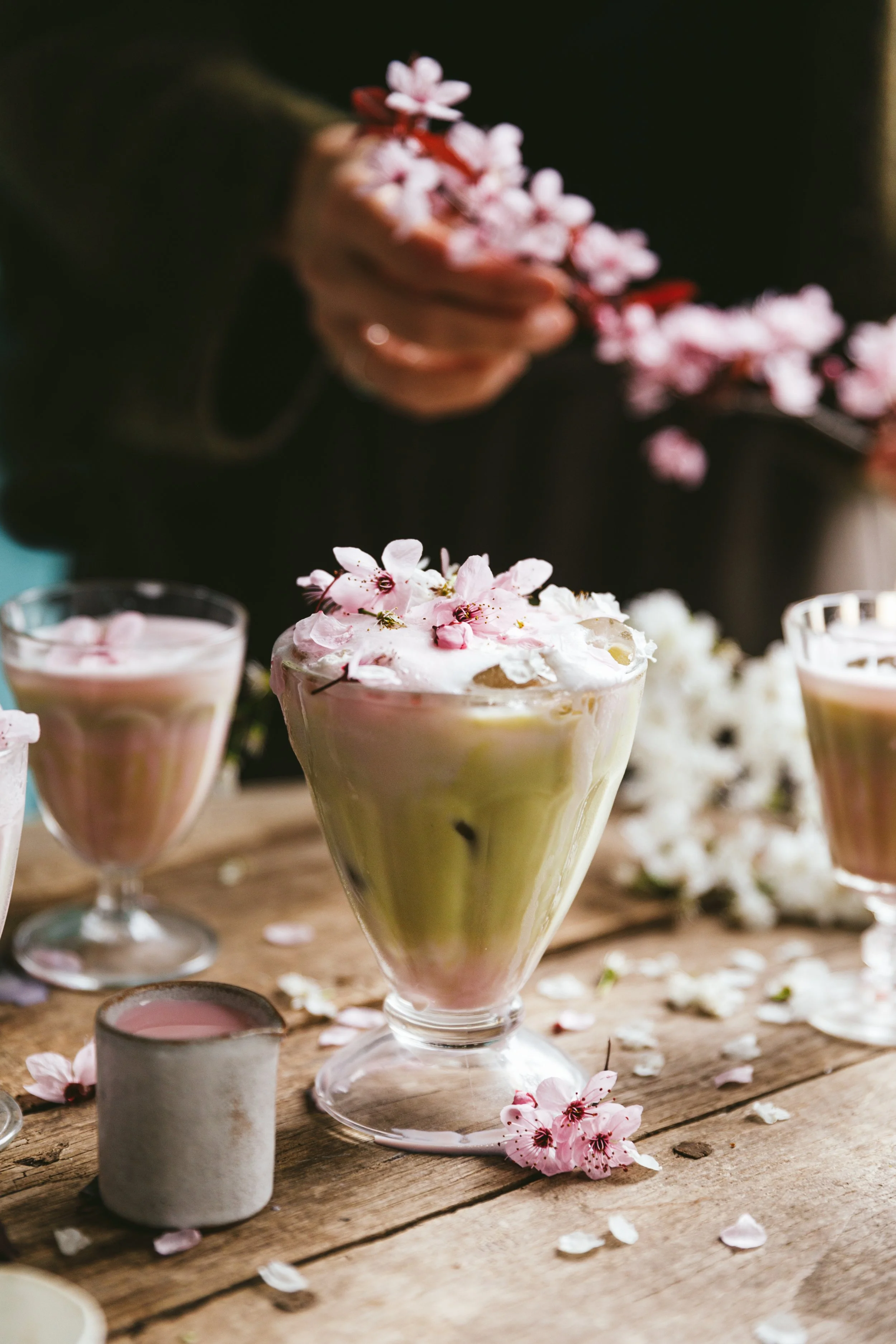 Blog post image showing a glass with a milky drink decorated with spring flowers