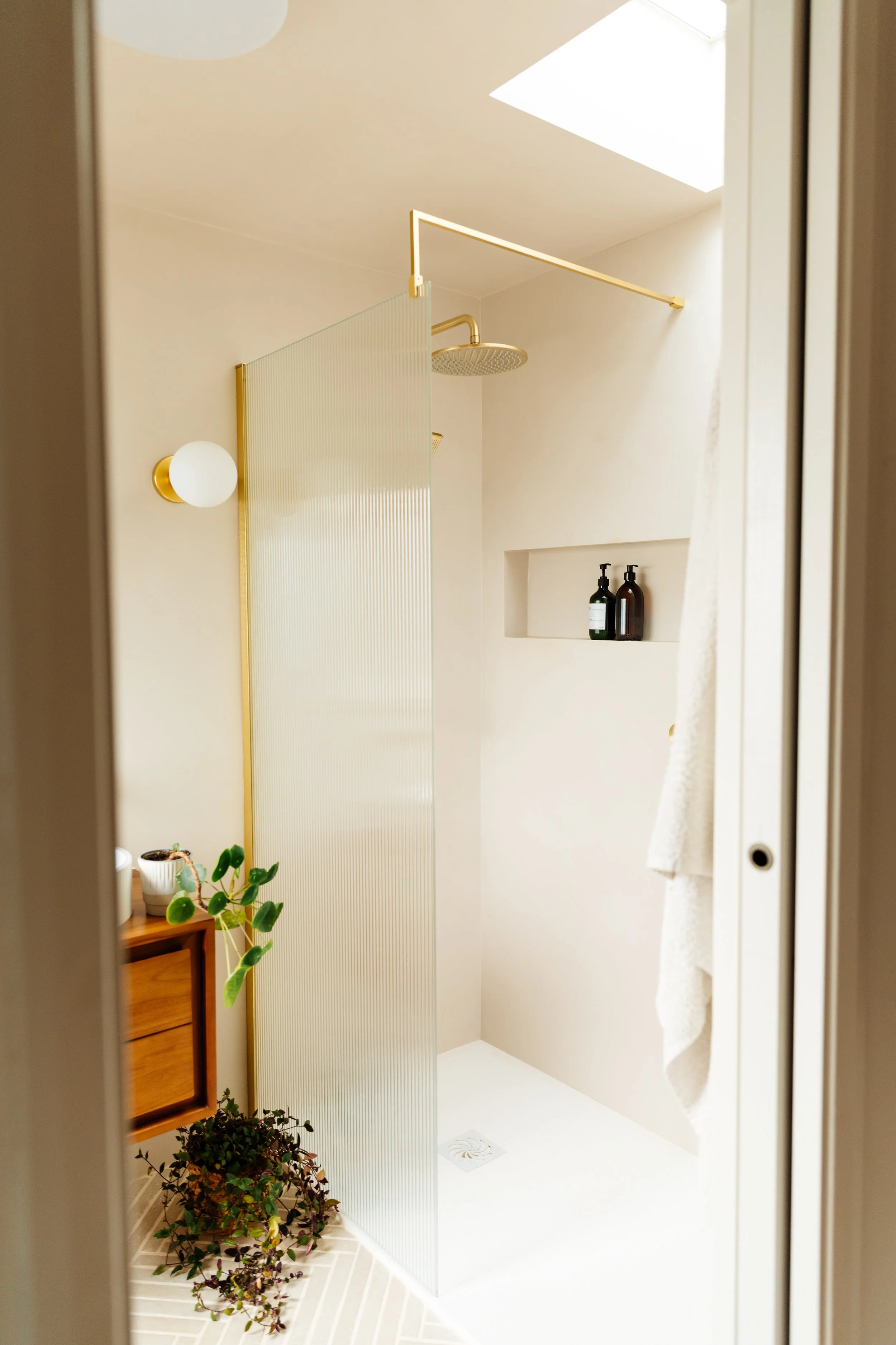 Blog post image showing a bright and elegant shower corner