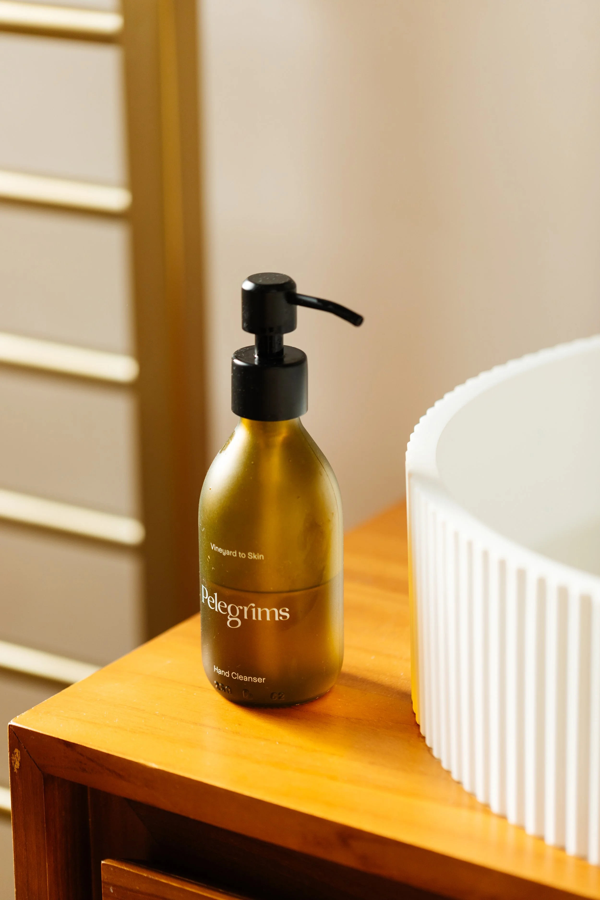 Blog post image showing an elegant hand soap bottle on a vanity unit