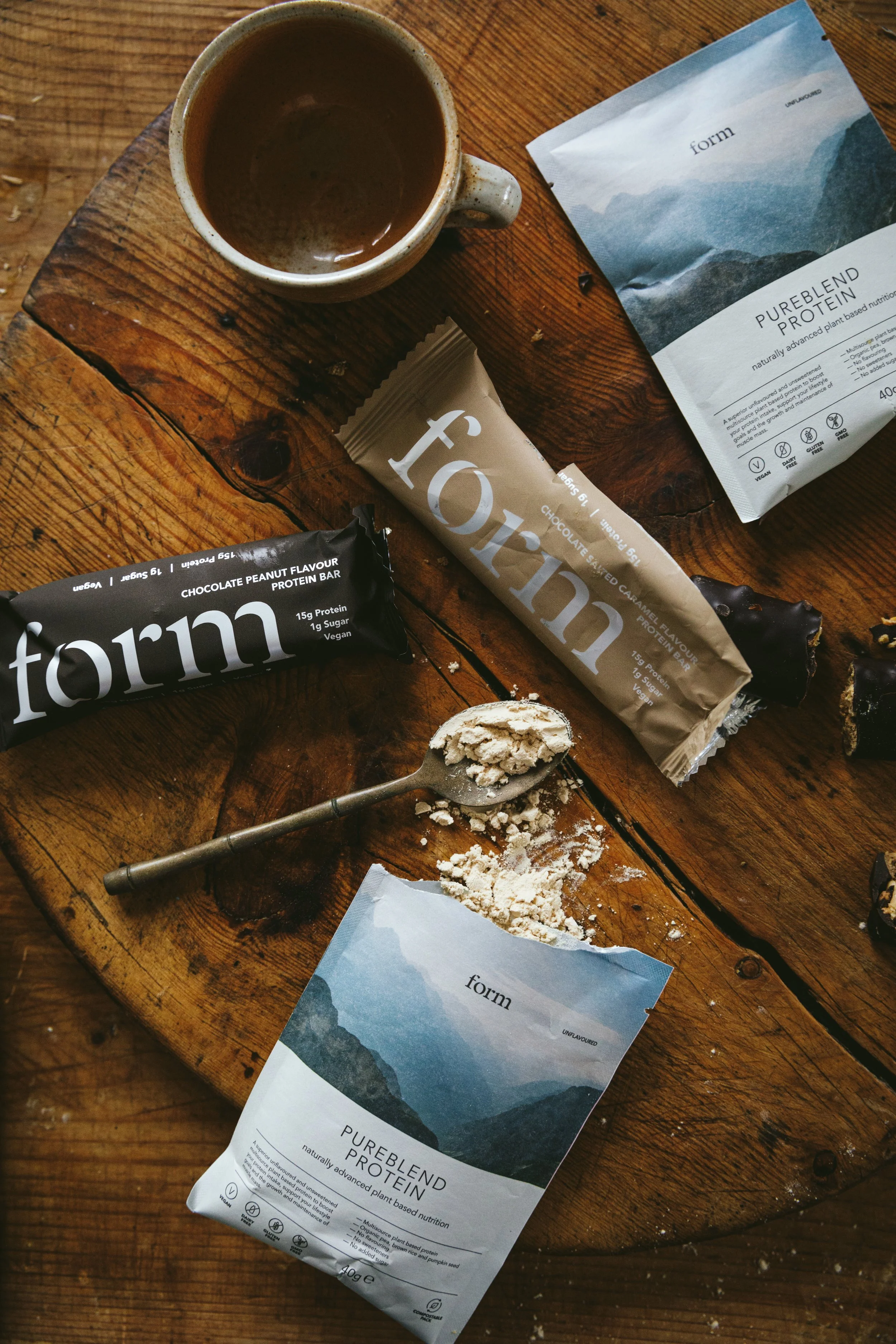 Blog post image showing packages of protein powder and protein energy bars