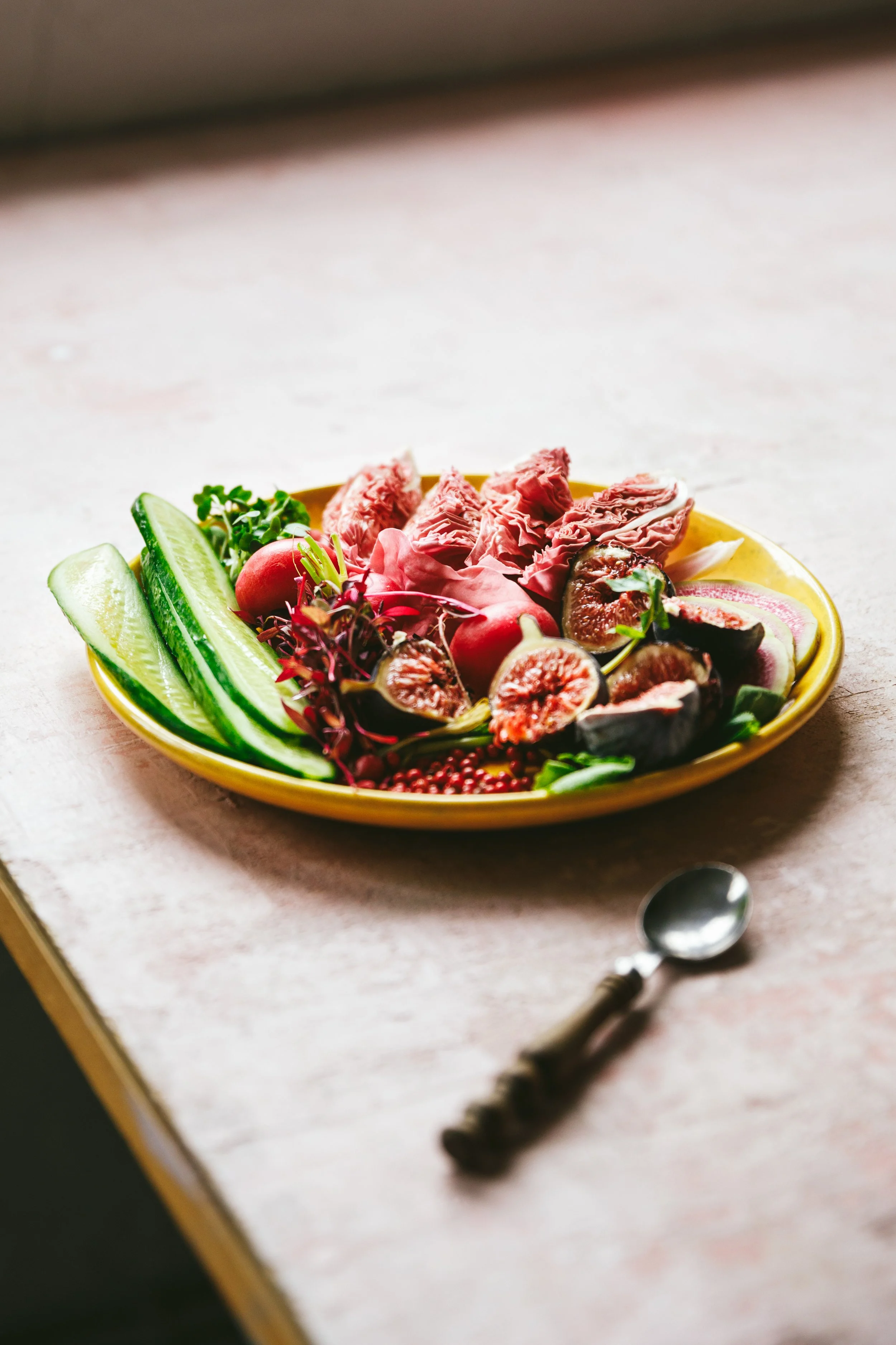 Blog post image showing a pretty salad with cucumber strips, radicchio, figs, radishes and other colourful salad ingredients