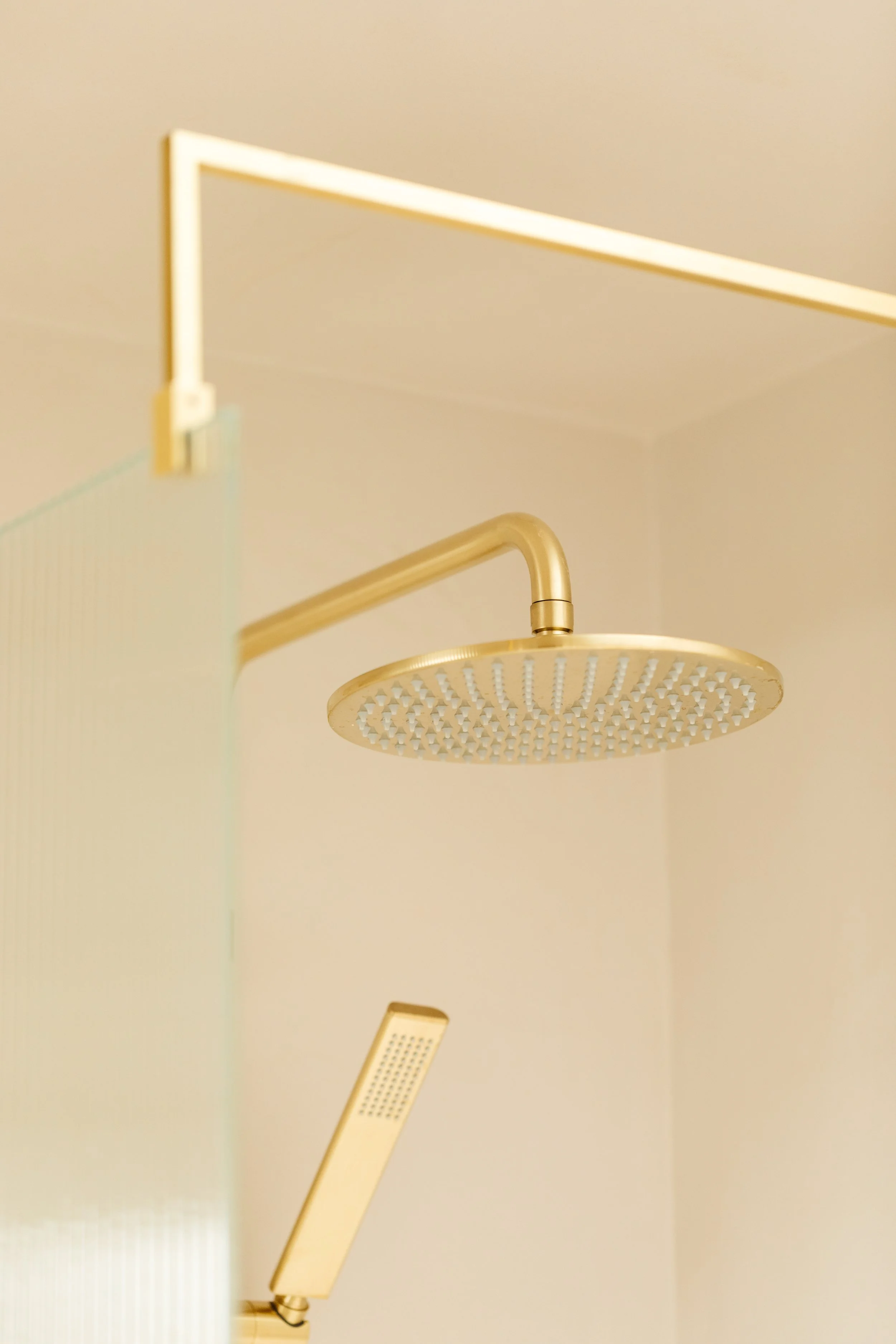 Blog post image showing a rain shower head and a detachable shower head