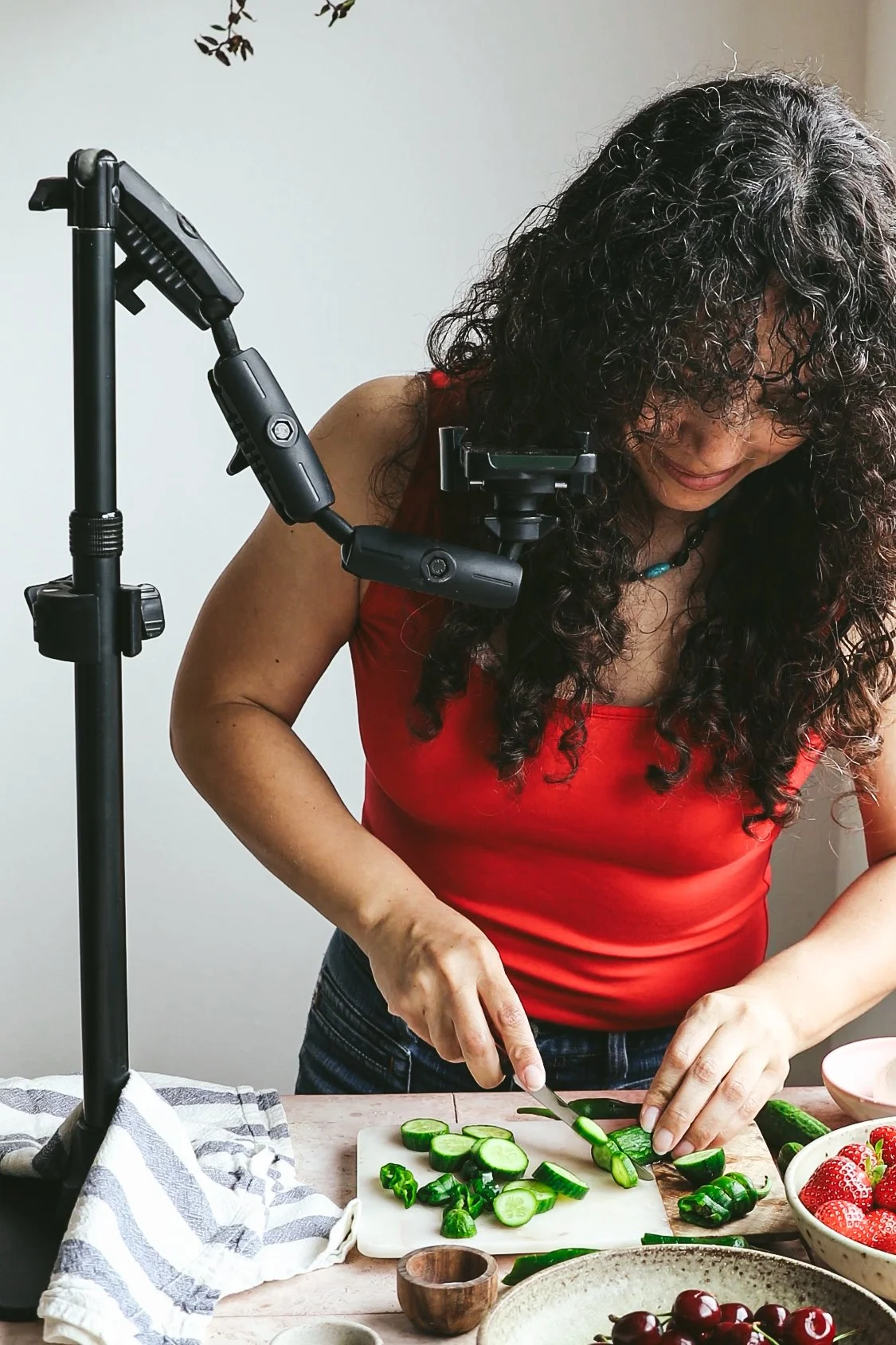 Blog post image showing author Kimberly chopping a cucumber